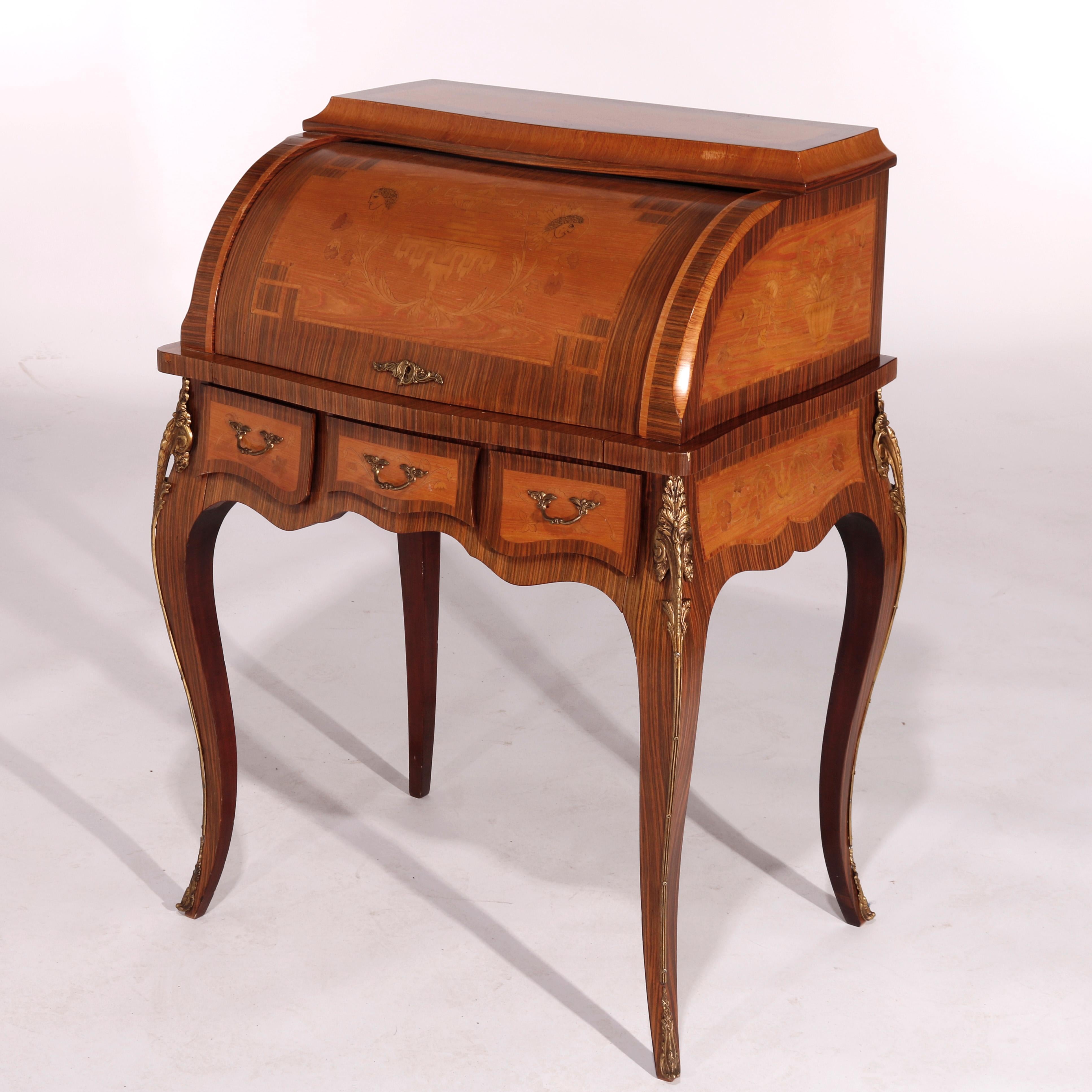 An antique French Louis XV style ladies desk offers deeply striated kingwood construction with barrell roll top opening to interior with pull out writing surface having satinwood marquetry music motif, raised on cabriole legs with cast ormolu