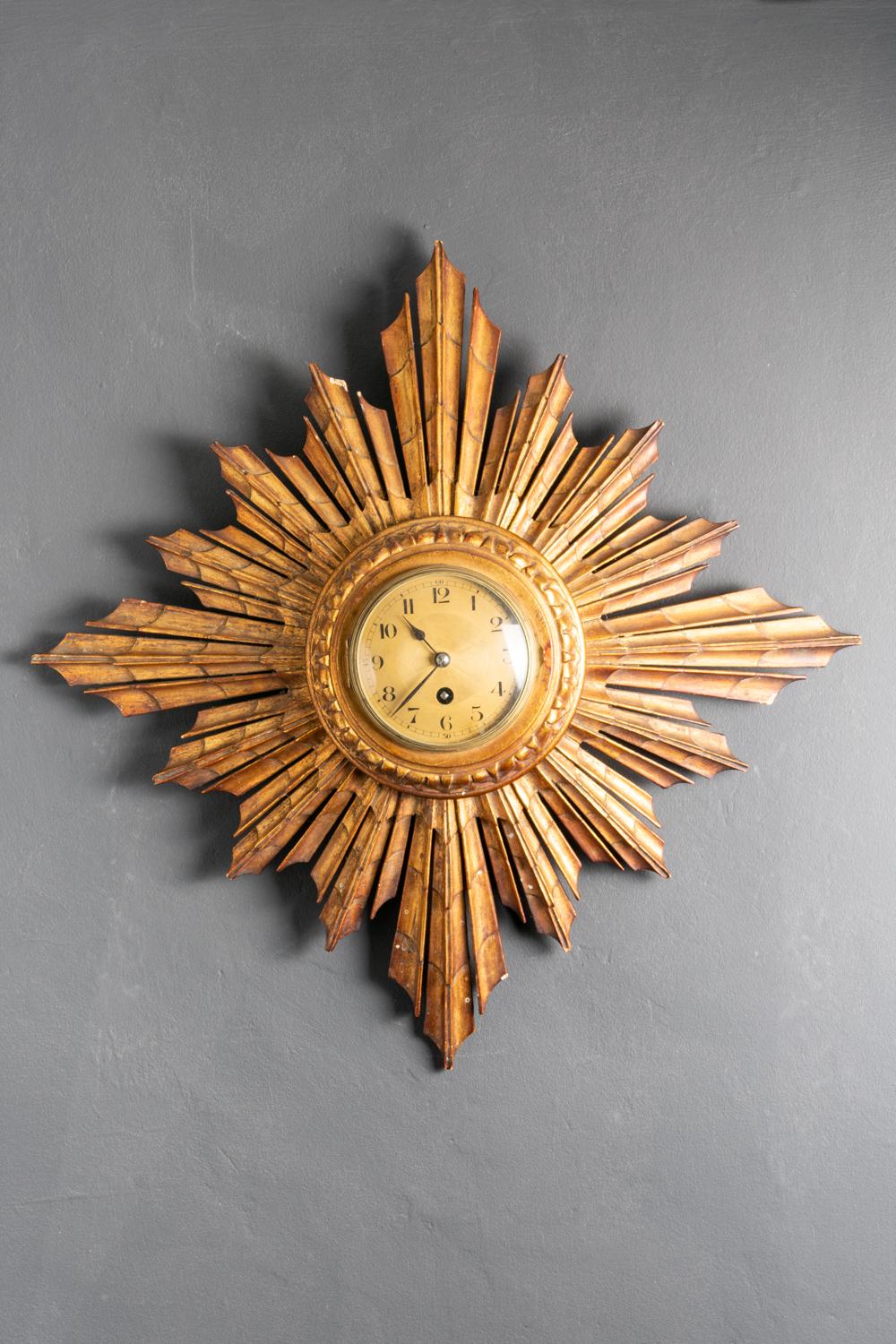 This magnificent late 19th-century French sunburst gilt wood clock is made by world well known Japy Freres & Co who were French clock makers founded by Frédéric Japy in 1777. The clock has beautifully hand-carved sun rays surrounding with richly