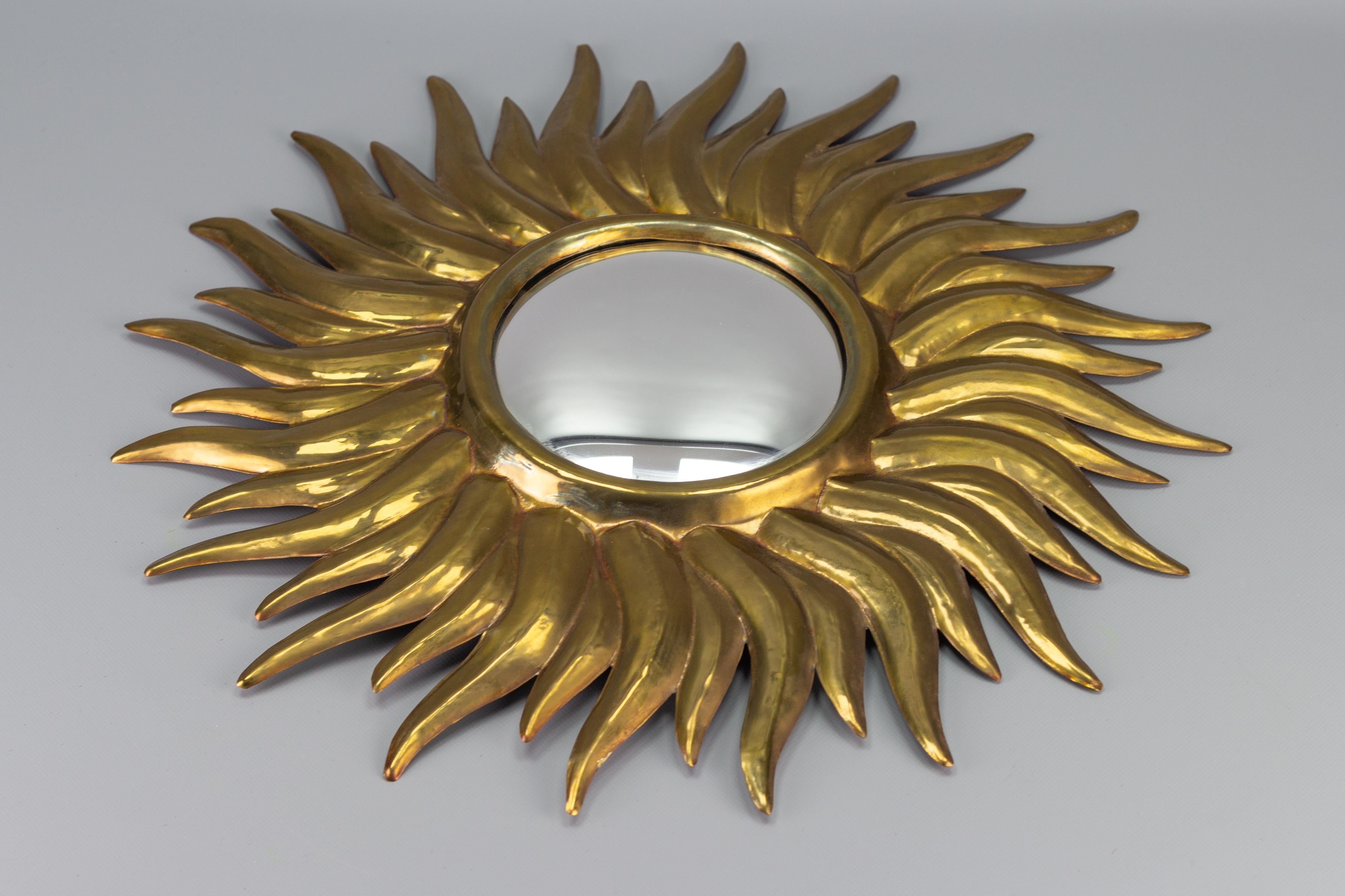 Adorable French late 19th-century golden wall mirror in the shape of the sun with convex mirror glass. The convex mirror gives a full view of the room and was originally made to watch servants.
Dimensions: 
diameter of the sun: 54 cm / 21.26 in;