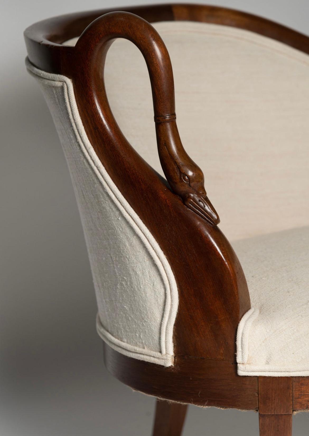 Elegant antique French swan neck small sofa, recently upholstered in antique French linen. Perfect size for any room or space. 16″ deep in the seat.