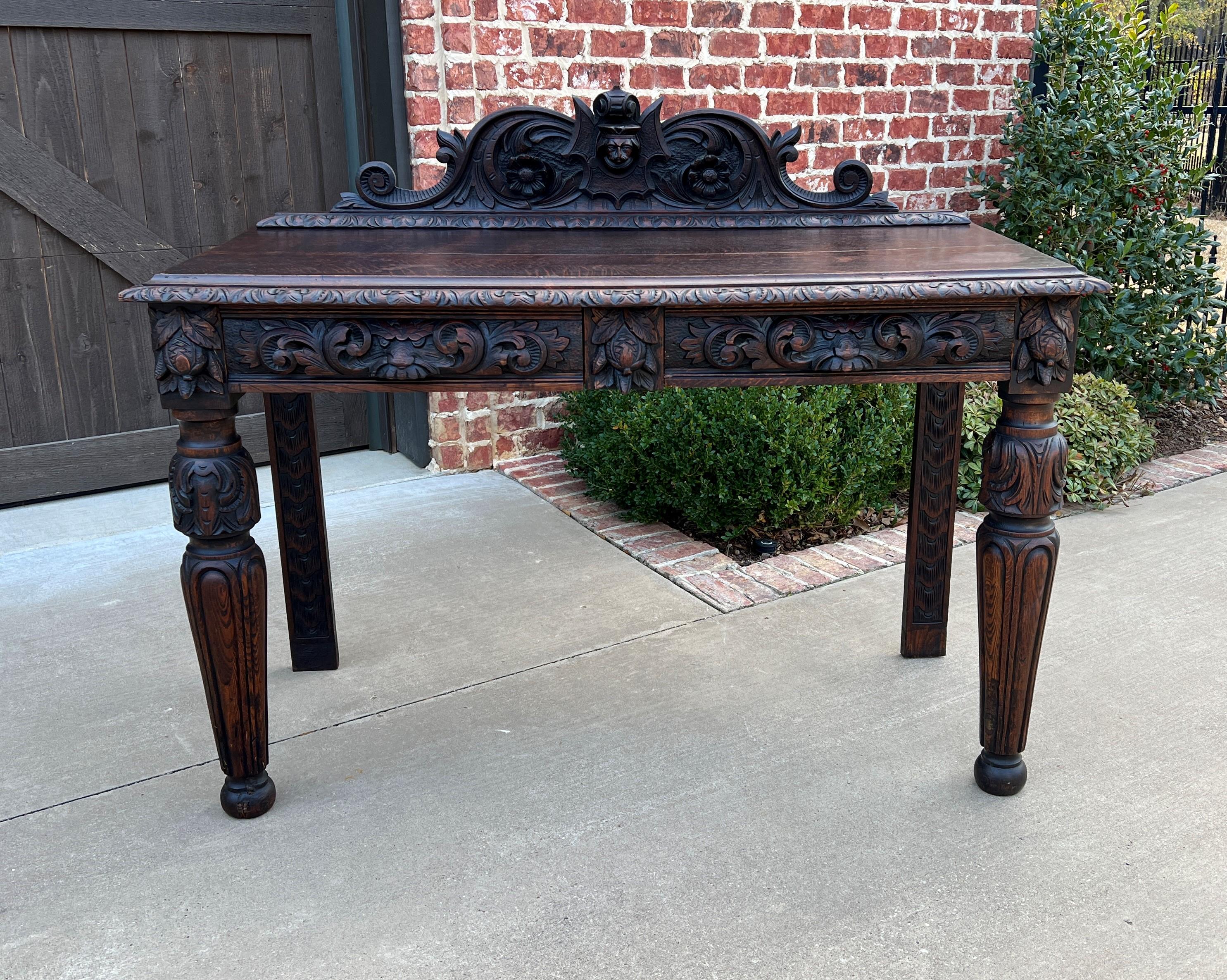 CHARMING Antique French Renaissance revival oak entry, hall table, sofa table or console with drawers ~~c. 1890s

Charming table with two drawers and carved crown~~perfect for use as a hall or entry table or sofa/console table 

Measures: 45