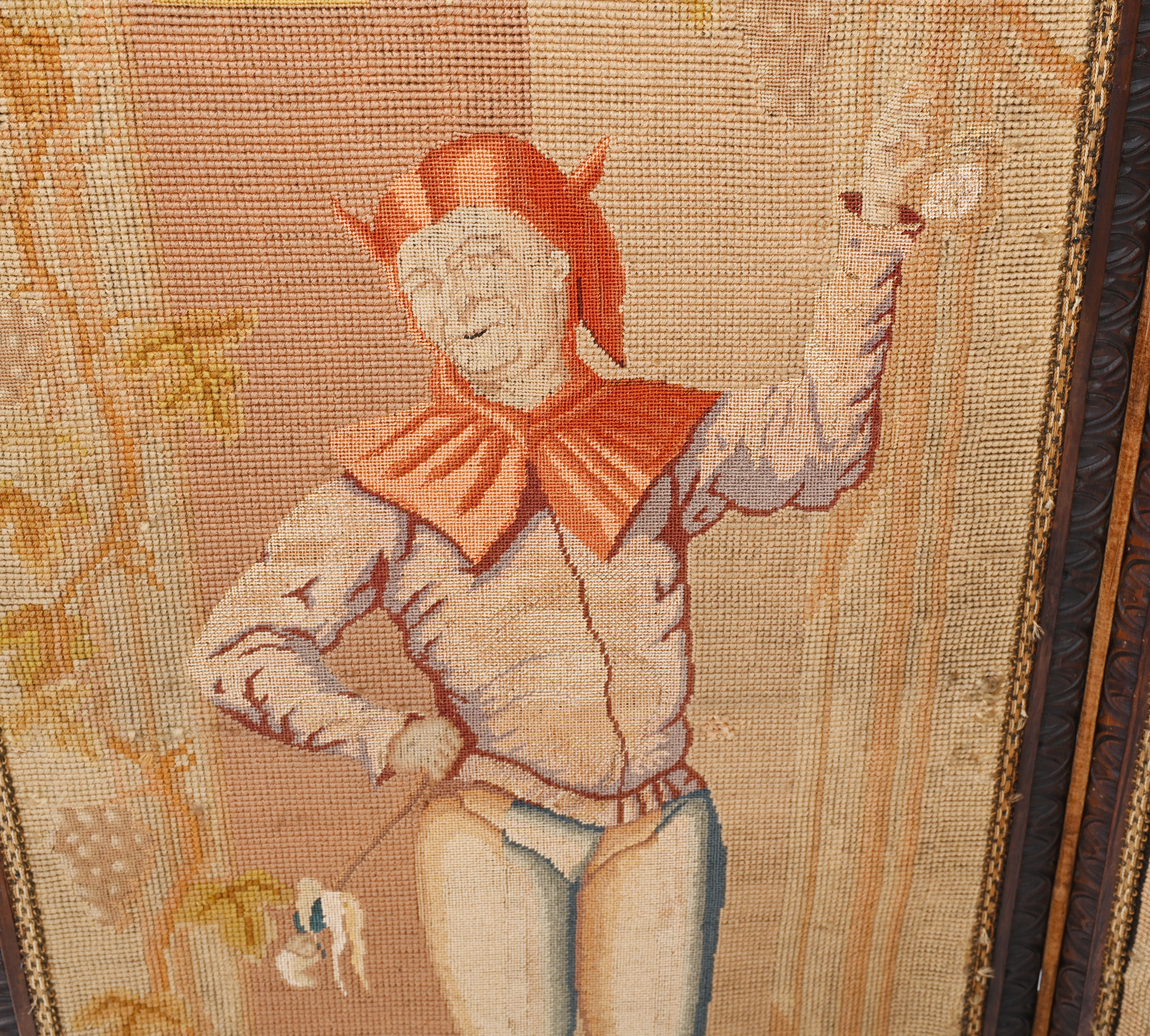 On trend antique French tapestry screen
Features four panels with a distinctive figure
Believed to be a courtly scene, one panel features a jester
This would elevate any room giving it a distintive look
The workmanship is superb, very