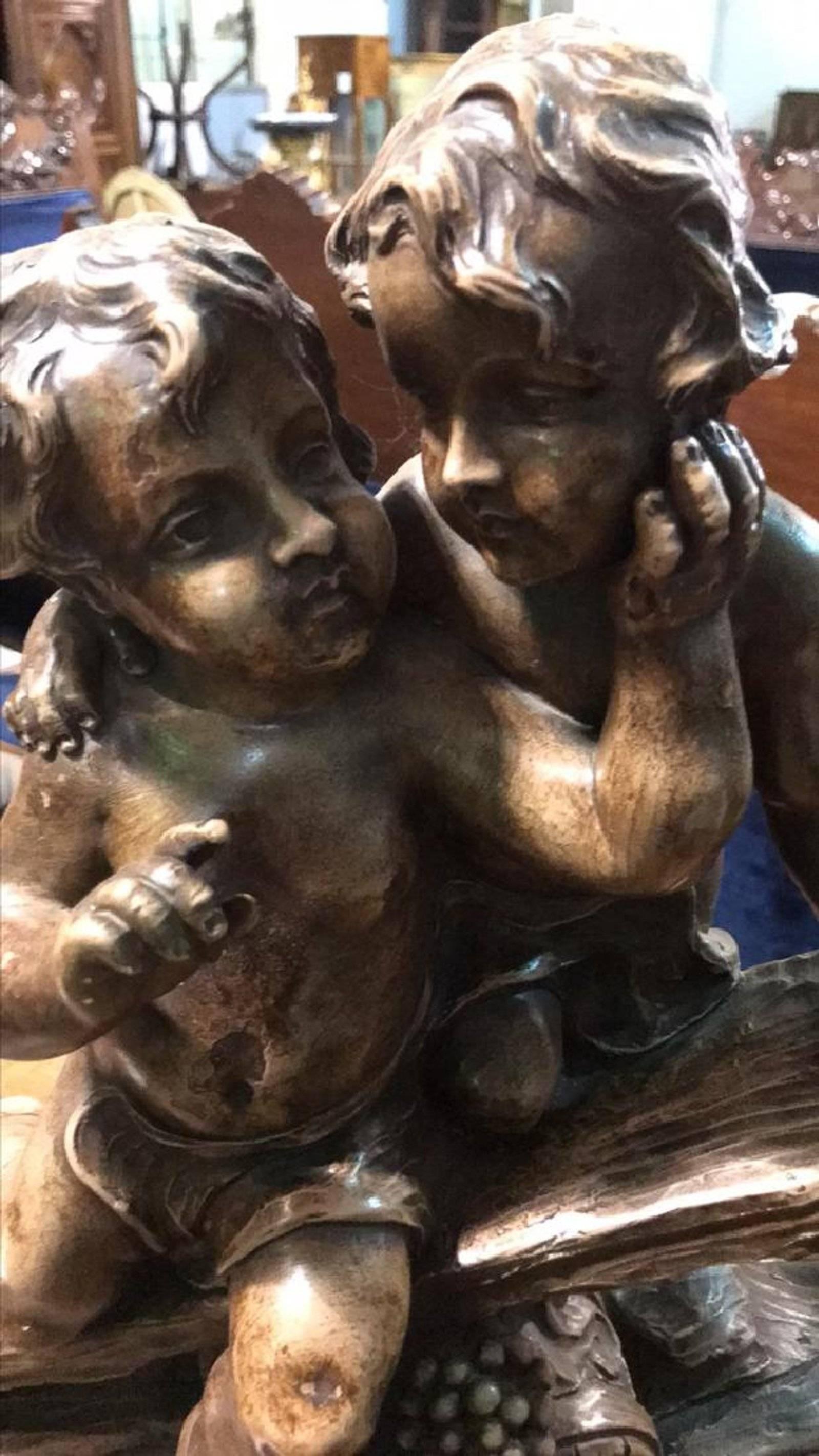 Superb antique French terracotta grouping of two playful cherubs atop driftwood with grape barrel and clusters, signed Balestru.

Wonderful gold brown patina. Exceptional detail.

No damage, restorations or repairs.