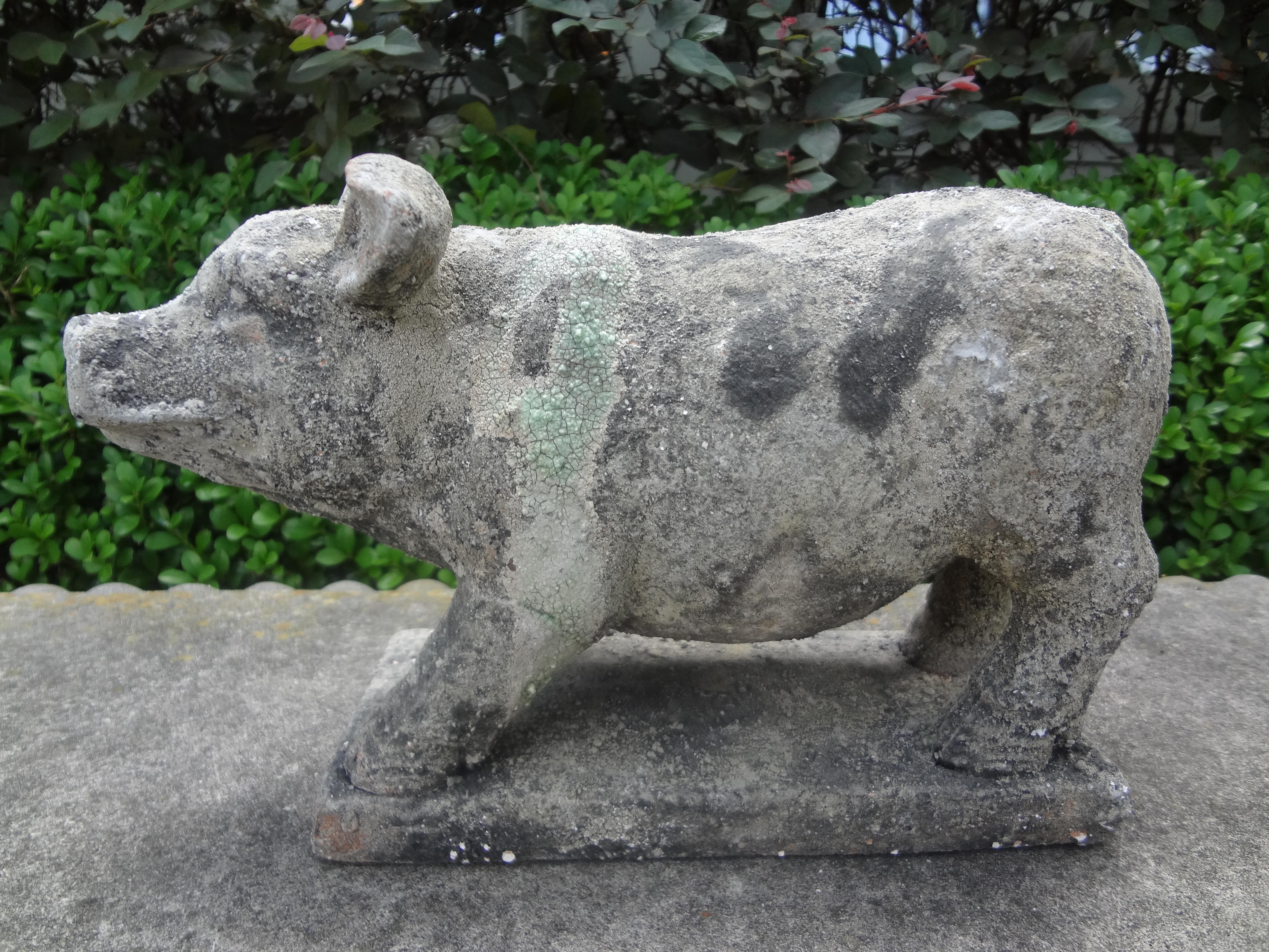 Antique French terra-cotta pig statue, figure or sculpture. This well detailed pig statue has a great patina and dates to the 1920's.