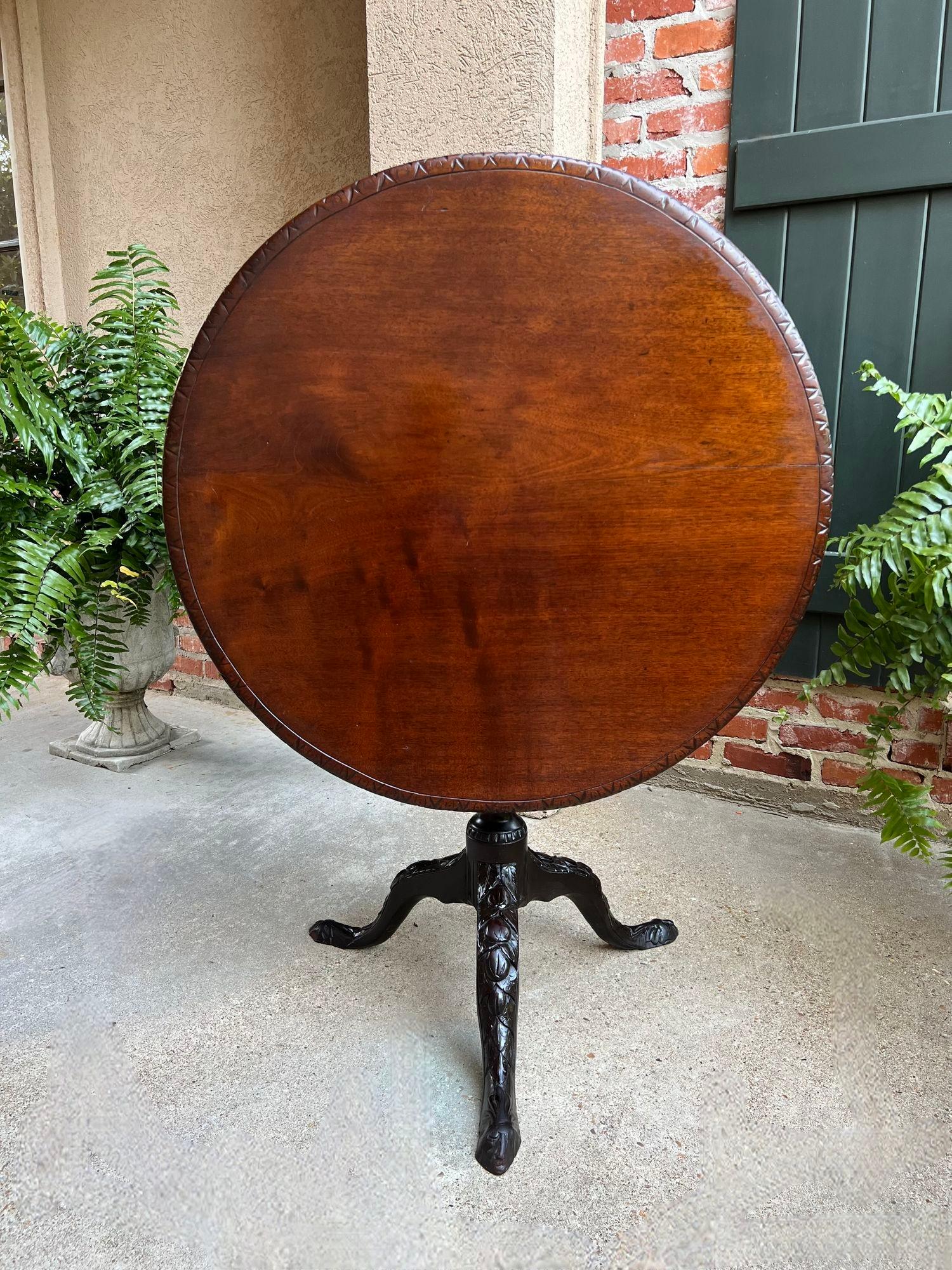 Antique English Tilt-Top Round Table Carved Mahogany Game Mahjong Wine c1890.

Direct from England, this gorgeous antique tilt-top table is a classic British beauty and probably one of the most sought-after tables today.
All the elements found in