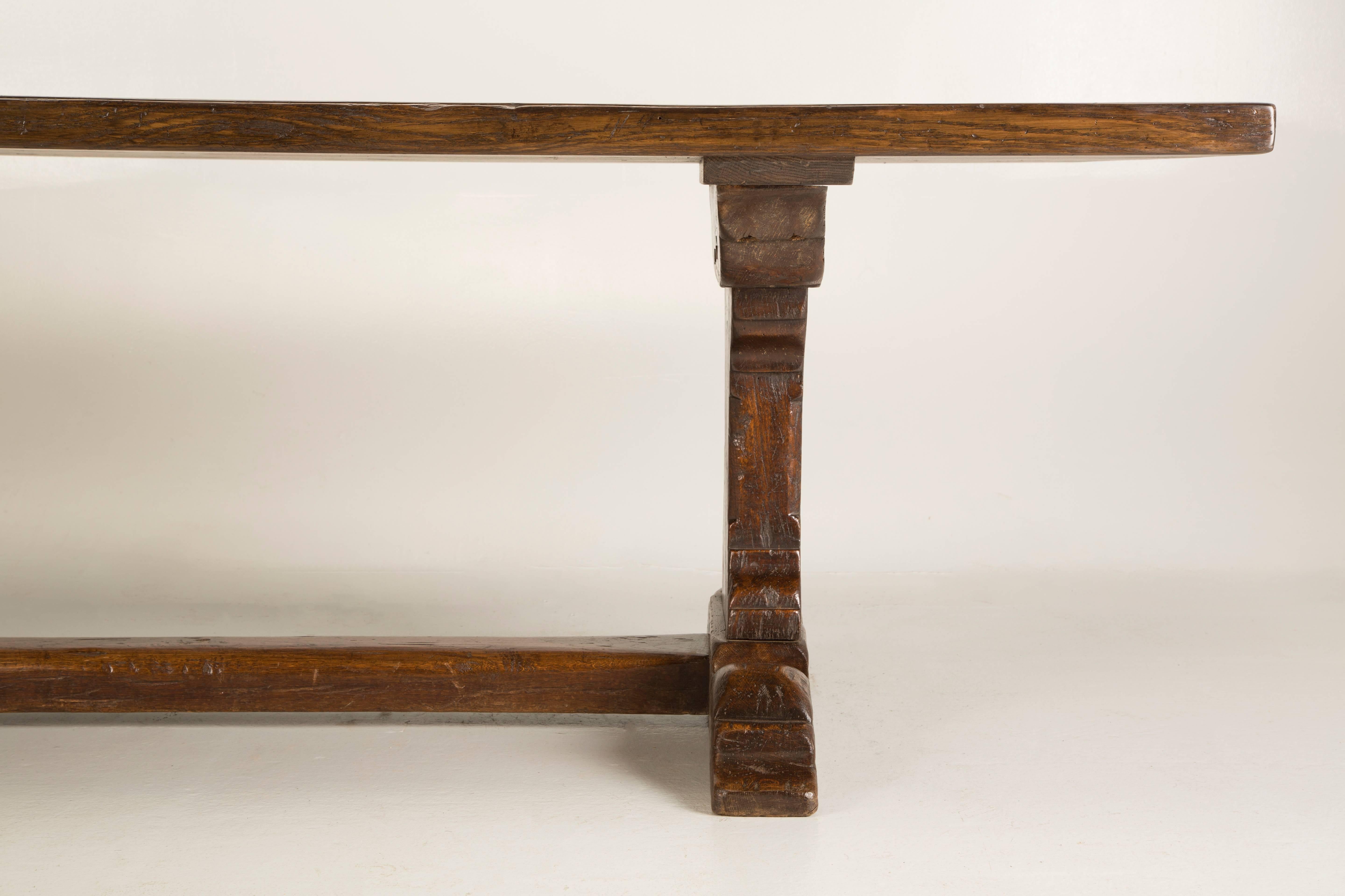 French antique oak trestle dining table, that was made, either in the late 1700s or very early 1800s. We discovered this antique French dining table, near the city of Toulouse, in the southwest region of France. The antique French oak farm table or