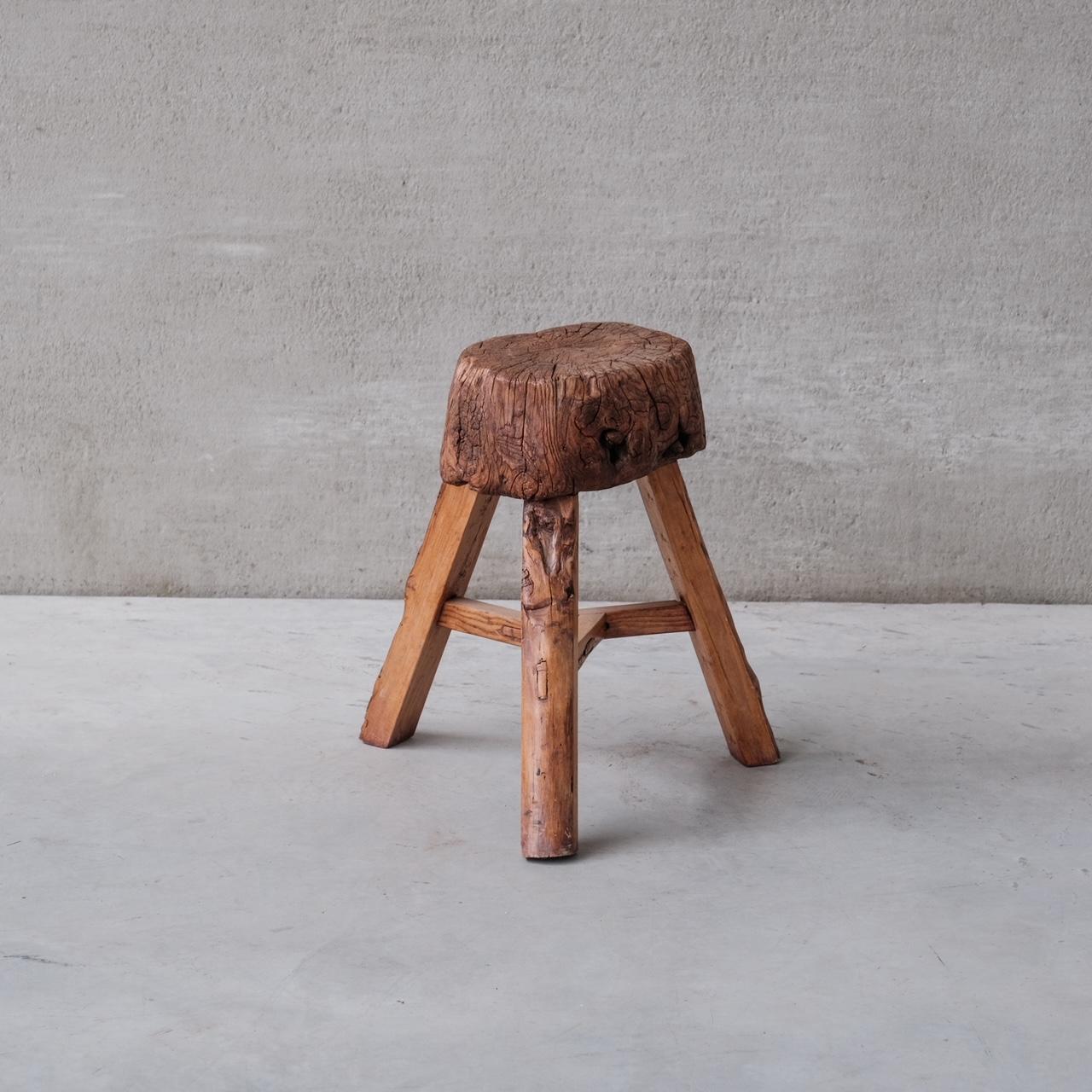 A primitive style butchers block or work block. 

France, c1930s. 

Raised over a tripod legs. Probably cut down at some point, now an ideal primitive style side table. 

Good antique condition. 

Location: Belgium Gallery. 

Dimensions: 54cm H x