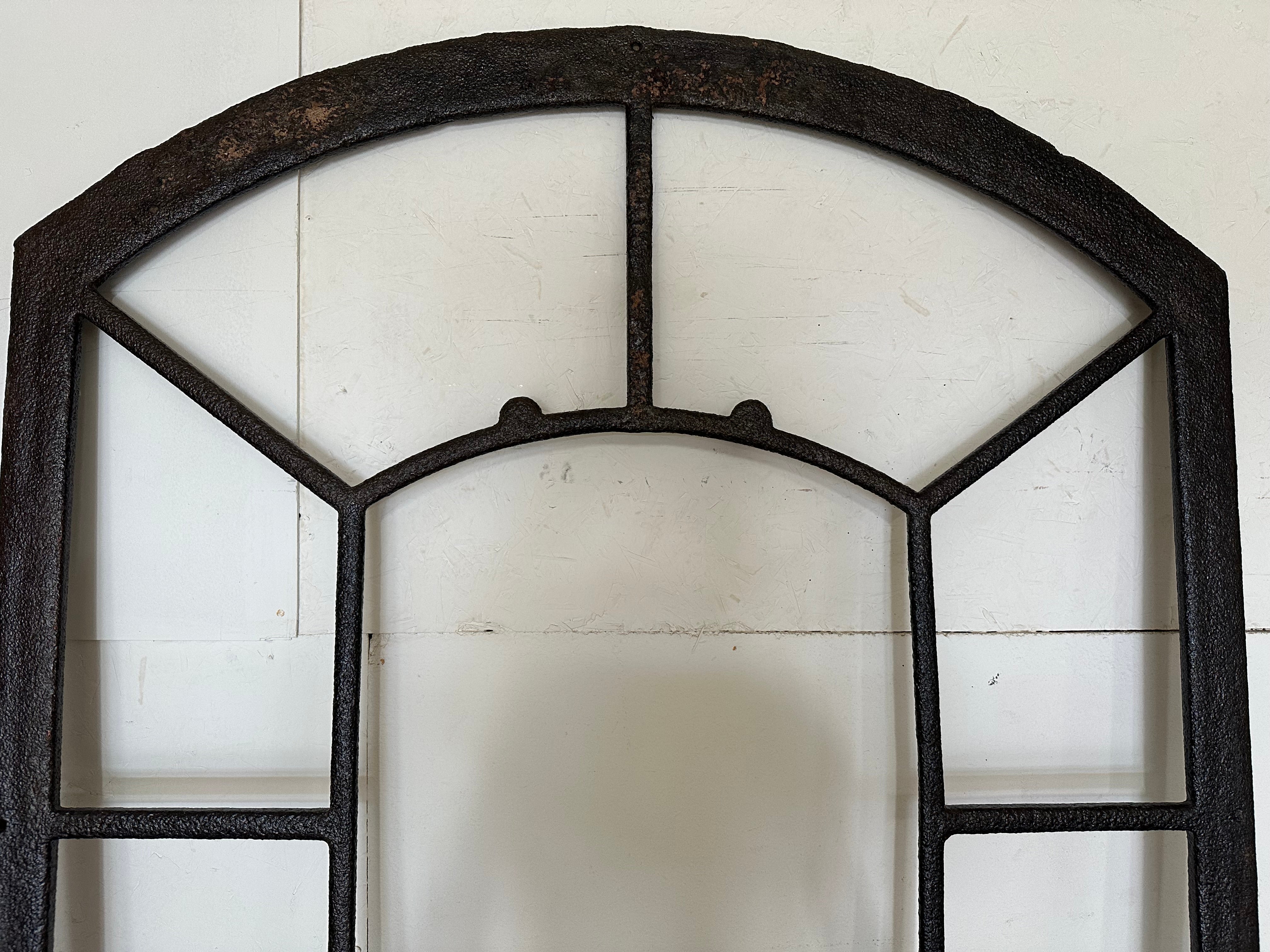 An elegant antique Neo-classic Tuilleries Orangerie window frame or wall mirror mirror frame with arched top made of hand crafted cast iron antique frame that once was a window from a French chateau.
Insert with mirror panels of your choice to