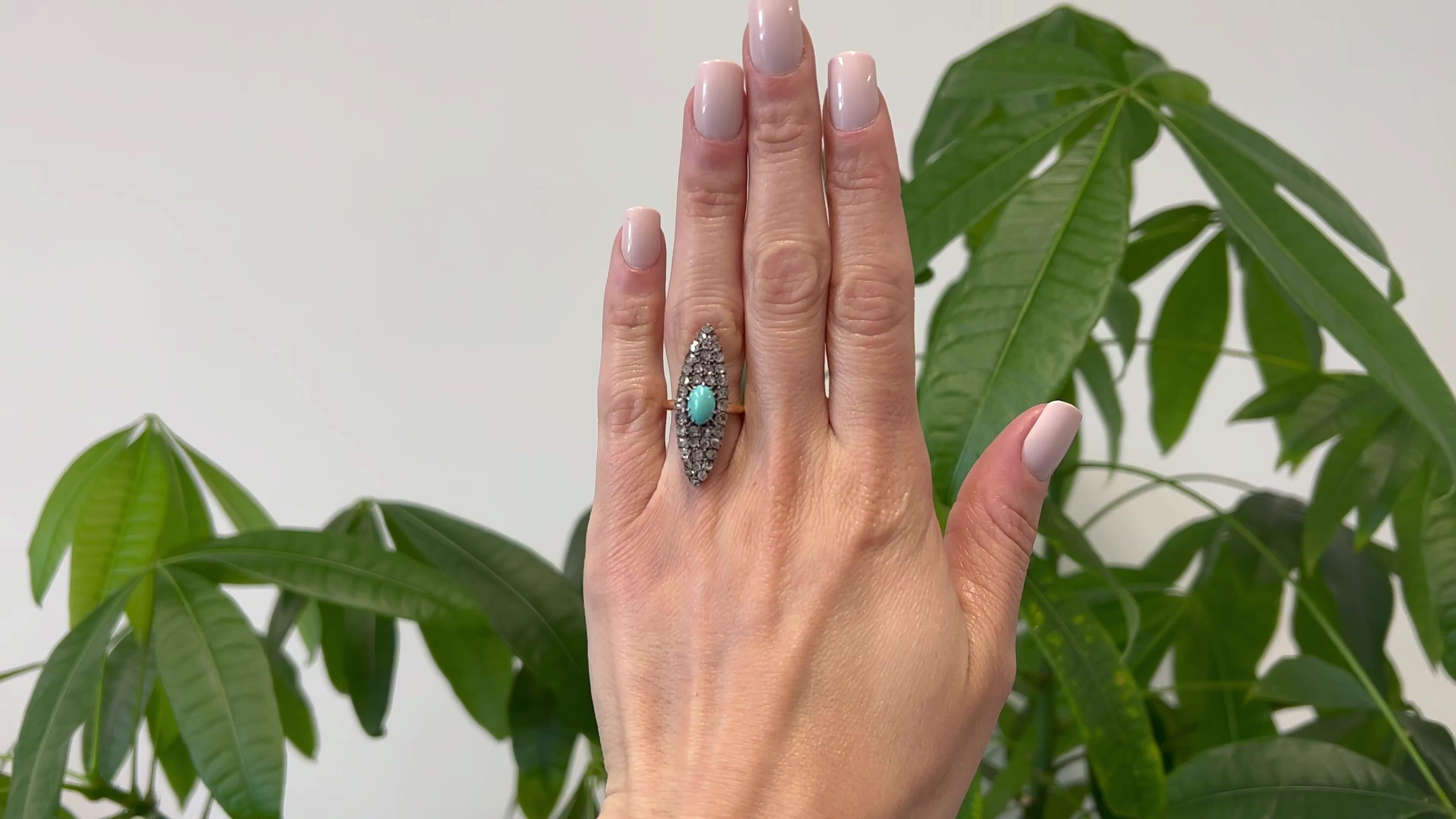 One Antique French Turquoise Diamond 18k Rose Gold Silver Navette Ring. Featuring one cabochon turquoise weighing approximately 1.10 carats. Accented by 40 senaille cut diamonds with a total weight of approximately 1.10 carats, graded I-J color,