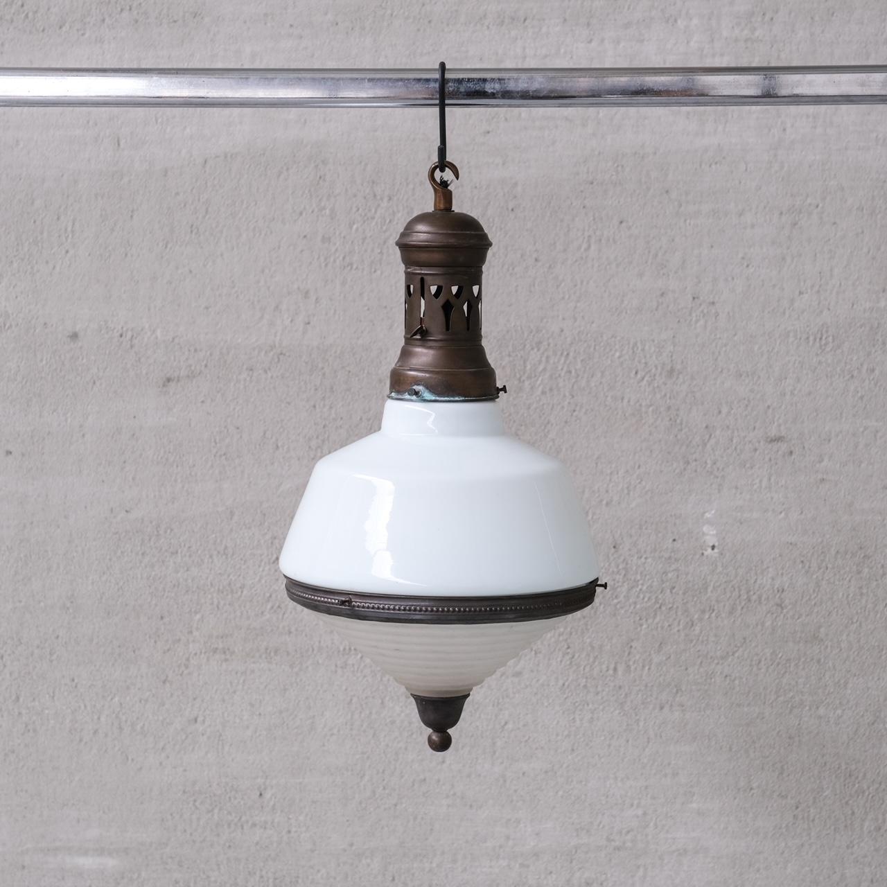 A good sized pendant light.

France, c1930s.

Two tone glass, opaline top, stepped opaque base.

Naturally patinated brass gallery, rim and finial.

Re-wired and PAT tested.

No chain or ceiling rose was retained, we can recommend where to