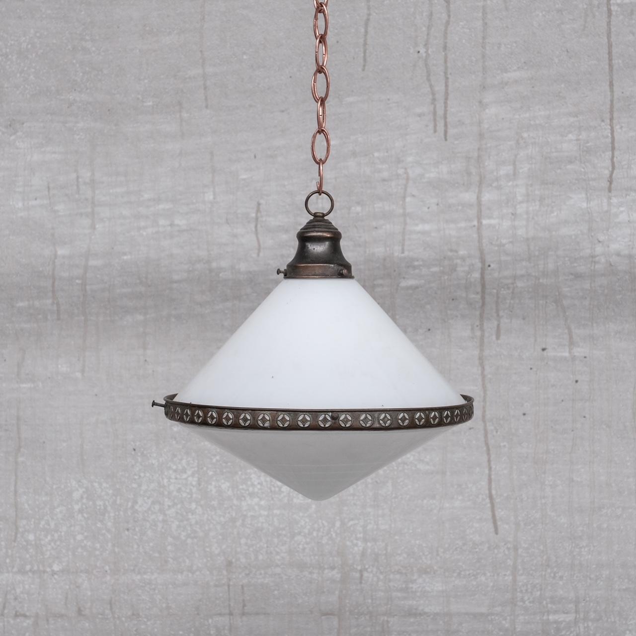A two tone antique French pendant light. 

France, c1930s. 

Patinated brass rim and gallery. 

Opaline glass top, with a more muted glass conical base. 

Lovely proportions. 

Since re-wired and PAT tested. 

The light remains in good