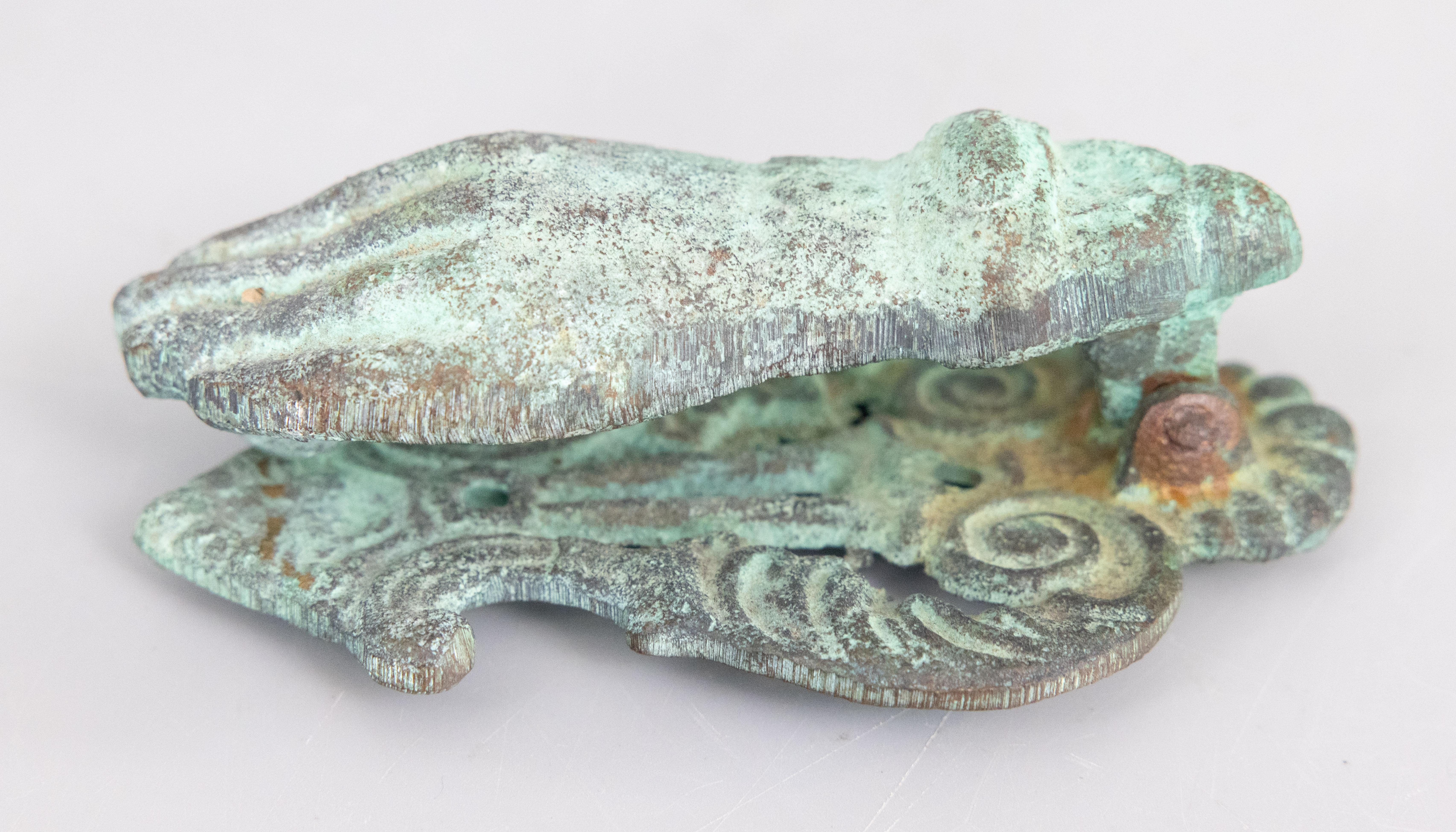 A gorgeous antique French cast iron hand door knocker, circa 1900. This beautiful door knocker is solid and heavy, in the shape of a lady's hand holding a ball, with a lovely aged verdigris patina. 

Dimensions
3ʺW × 2ʺD × 5.5ʺH