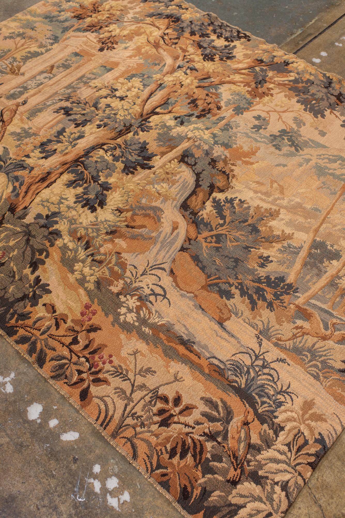 Antique French Verdure Tapestry with Architectural Ruins and Woodland Landscape Francés en venta