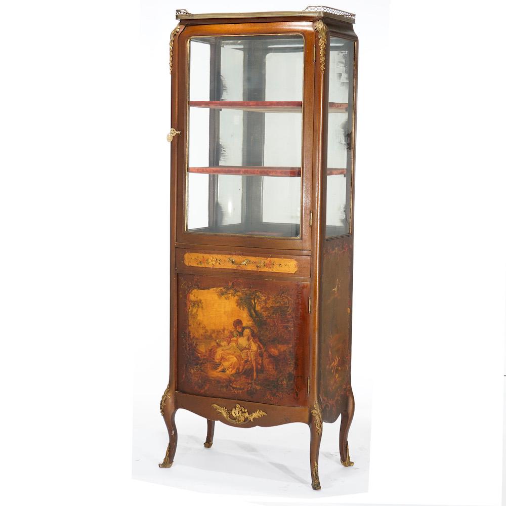An antique French Vernis Martin decorated vitrine offers mahogany construction with single glass door opening to shelved interior over drawer and single door cabinet with courting scene, raised on cabriole legs, foliate cast ormolu throughout,