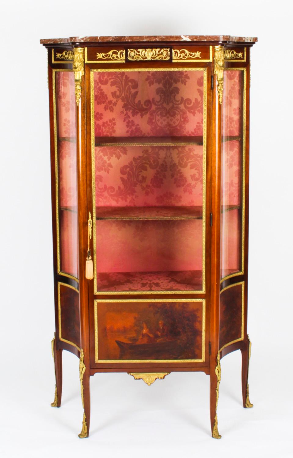 This is a fabulous antique French Louis Revival Vernis Martin ormolu mounted mahogany display cabinet, circa 1880 in date.

This beautiful cabinet has hand painted decoration, exquisite ormolu mounts and a beautiful marble top. The central panel
