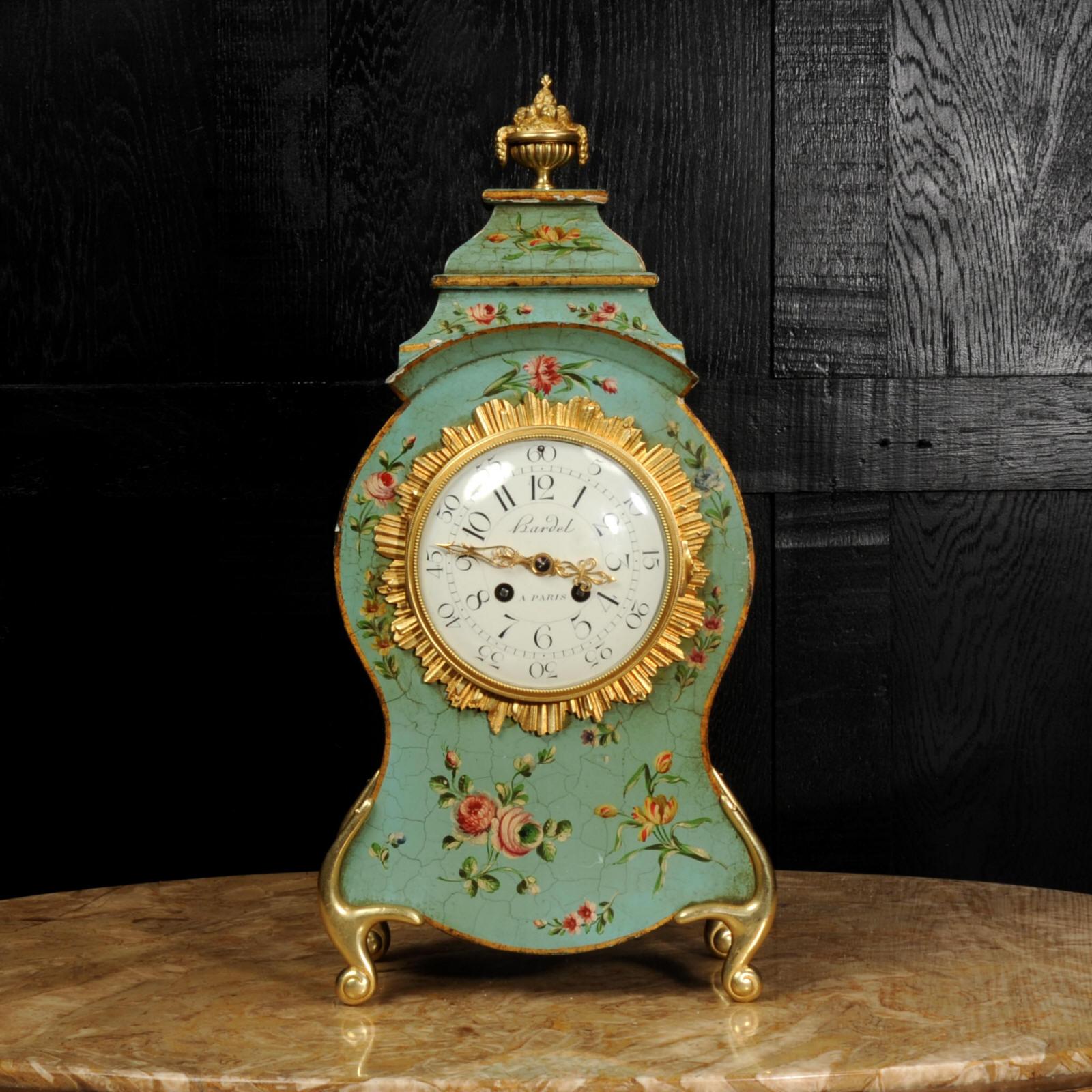 A large and beautiful antique French Vernis Martin style lacquer clock by Planchon of Paris. Decorated in exquisite Eau de Nil ground with delicate floral swags, mounted with crisp ormolu (finely gilded bronze) mounts.

The large dial is porcelain