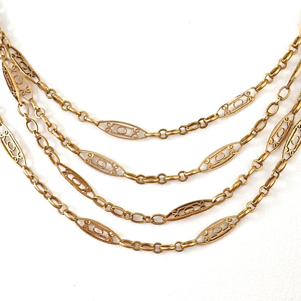 Luxurious antique French 18k gold necklace. Made with one of a kind links and intricately designed oval stations. Can be wrapped several times as it is 62 inches long. Weighs 16 grams. 