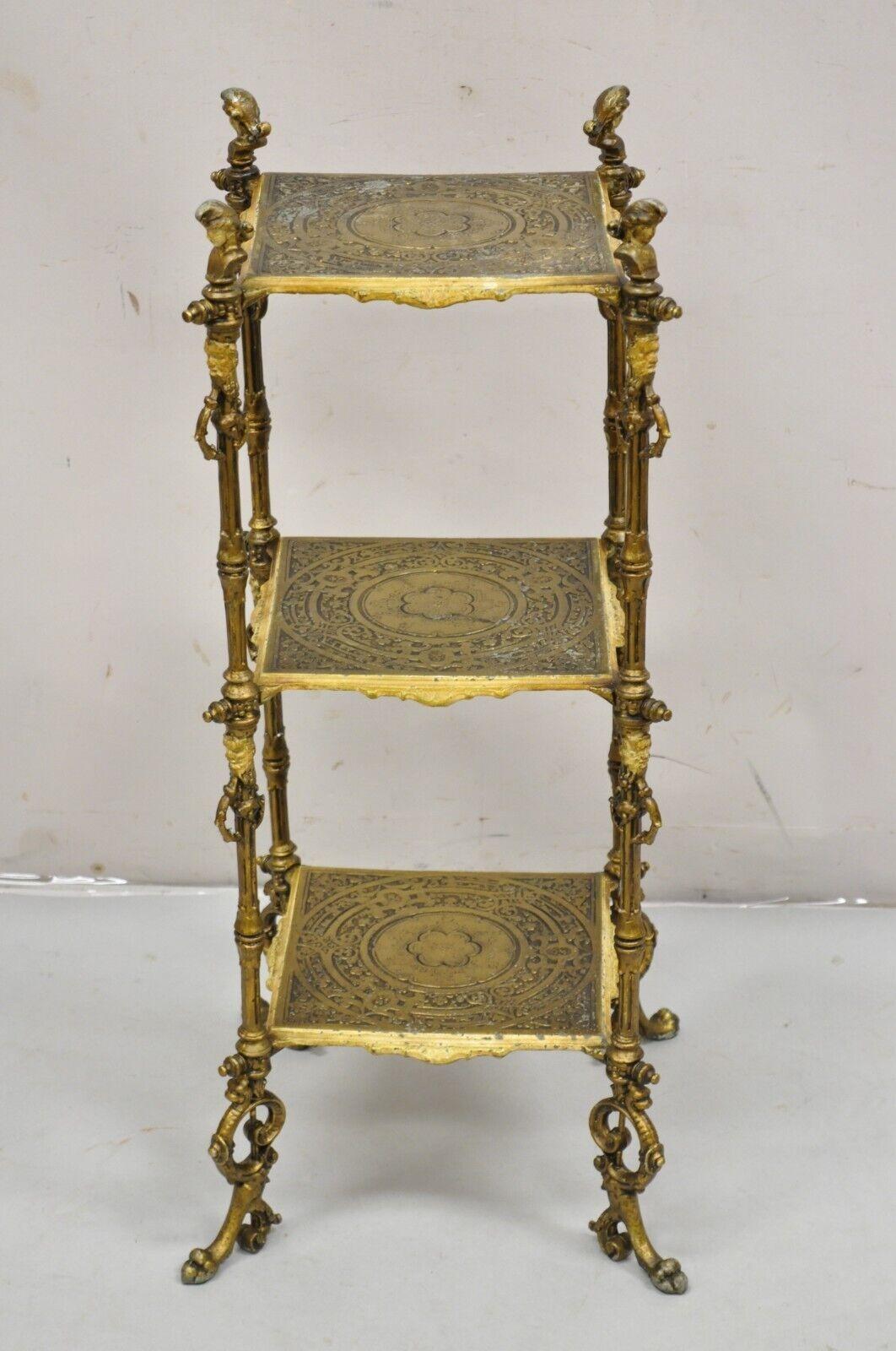 Antique French Victorian Bronze 2 Tier Onyx Stone Plant Stand Accent Table. Item features a bronze figural frame with male and female figures, 2 oval onyx stone surfaces with onyx finials, very nice antique table. Circa 19th Century. Measurements: