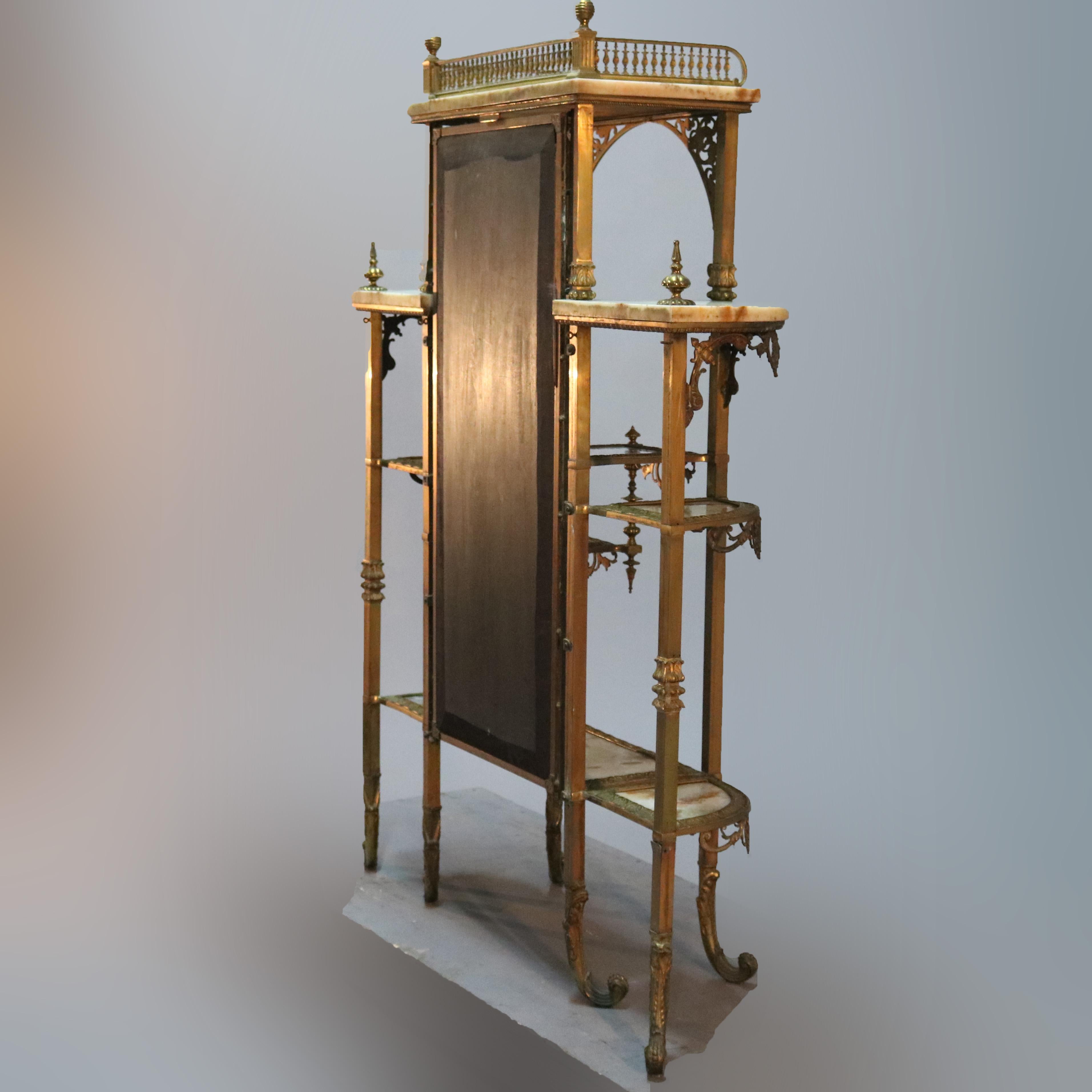 An antique French Victorian étagère offers bronze frame having central long mirror flanked by demilune shelved sides, scroll and foliate elements throughout, onyx shelving, pierced upper gallery and raised on scroll form feet, circa