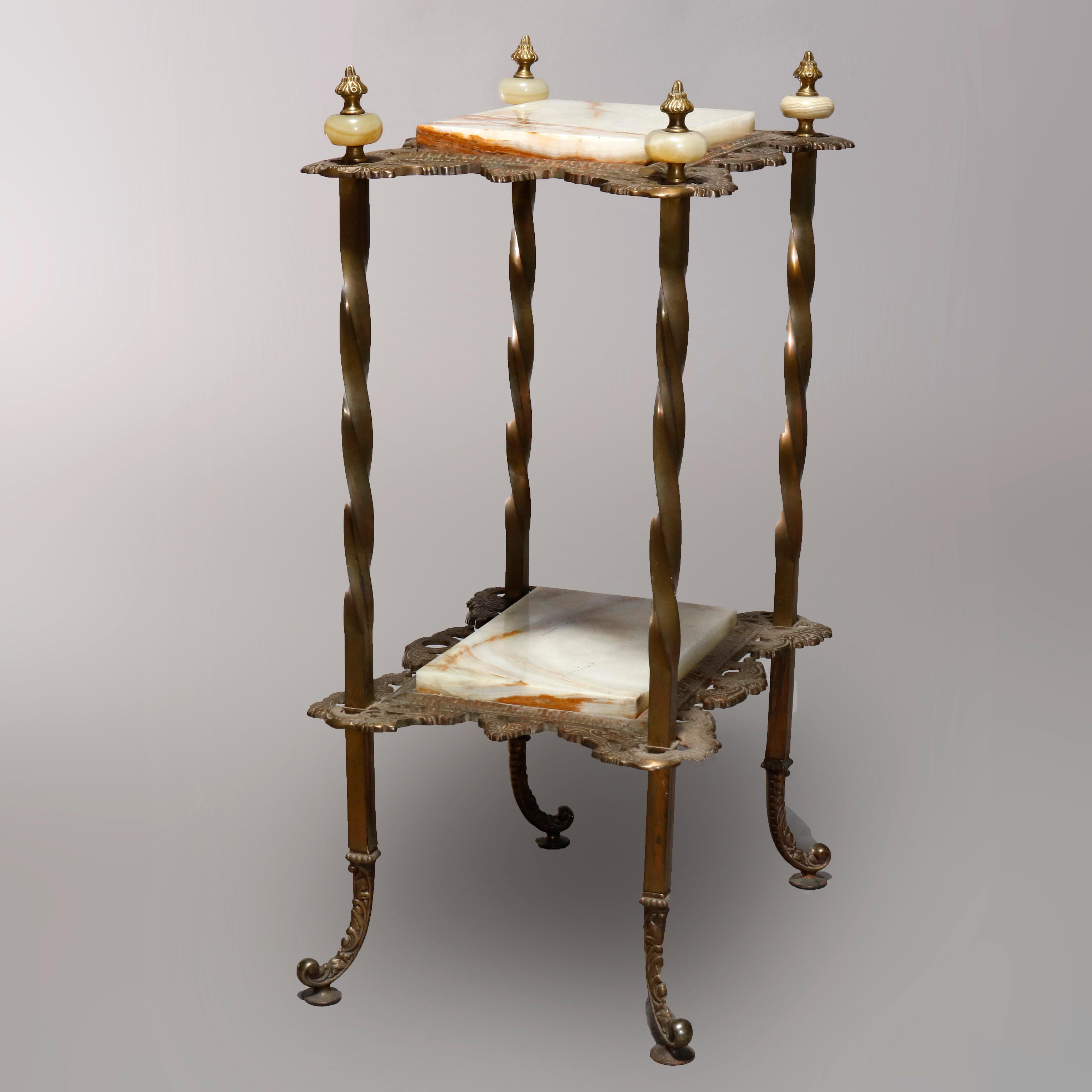 An antique French Victorian plant stand offers bronze frame with twisted columns having tiered pierced foliate cast trays housing onyx shelves, circa 1880.

Measures: 32