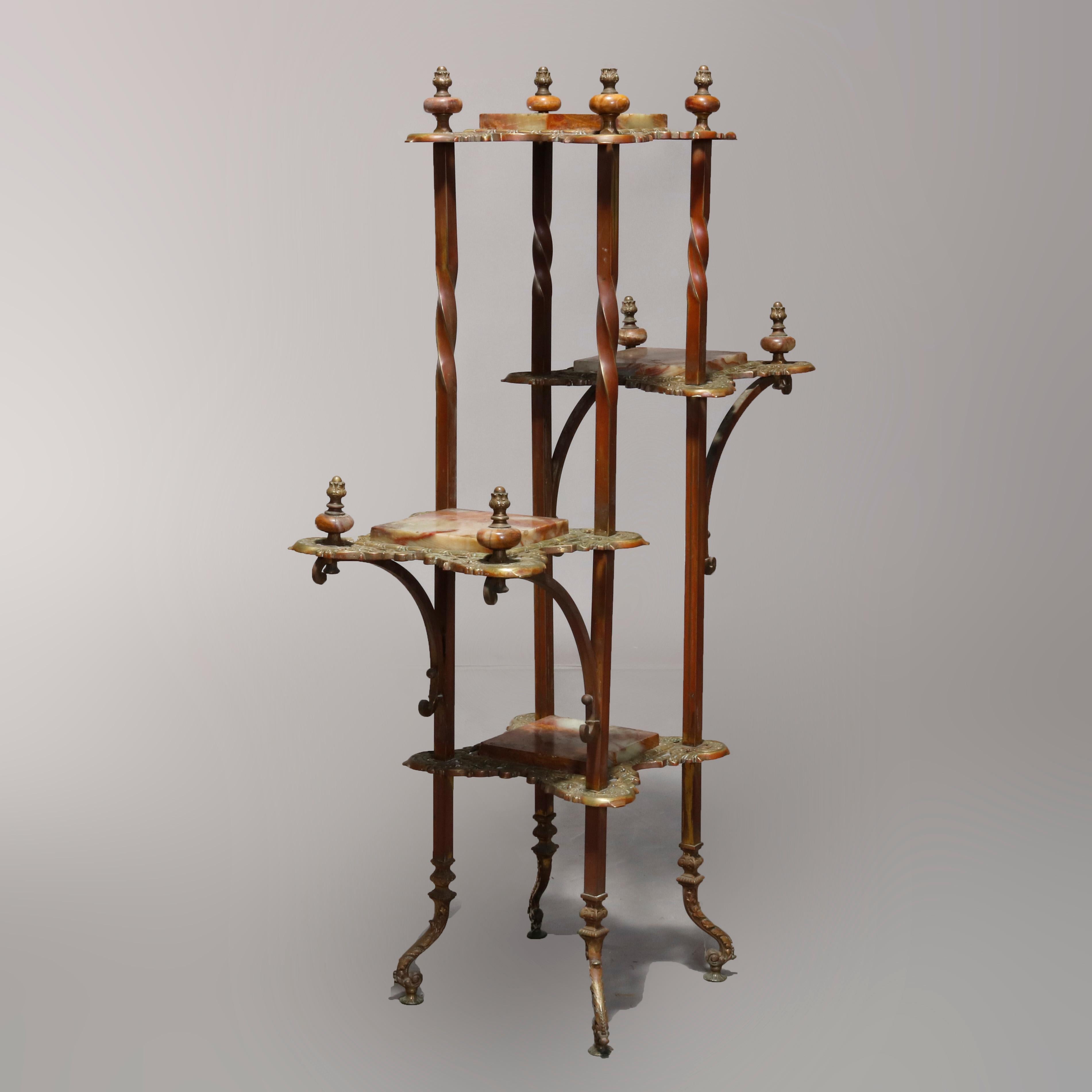 An antique French Victorian étagère offers bronze frame with twisted columns having tiered pierced foliate cast trays housing onyx shelves, circa 1880

Measures: 46.5