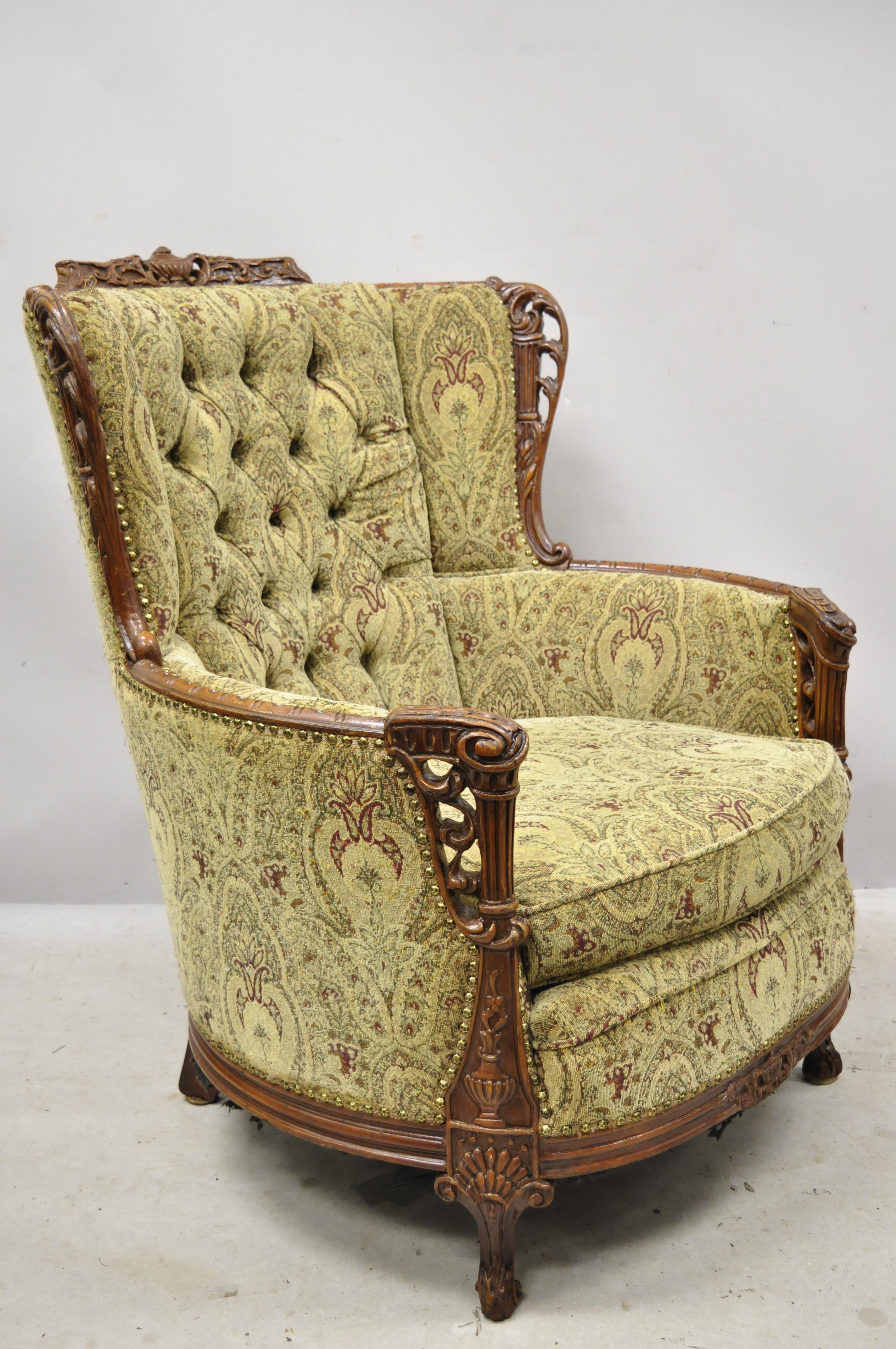 Antique French style Victorian carved mahogany flame urn wingback parlor lounge chair. Item features solid wood frame, nicely carved details, very nice antique item, great style and form, circa early 1900s. Measurements: 41