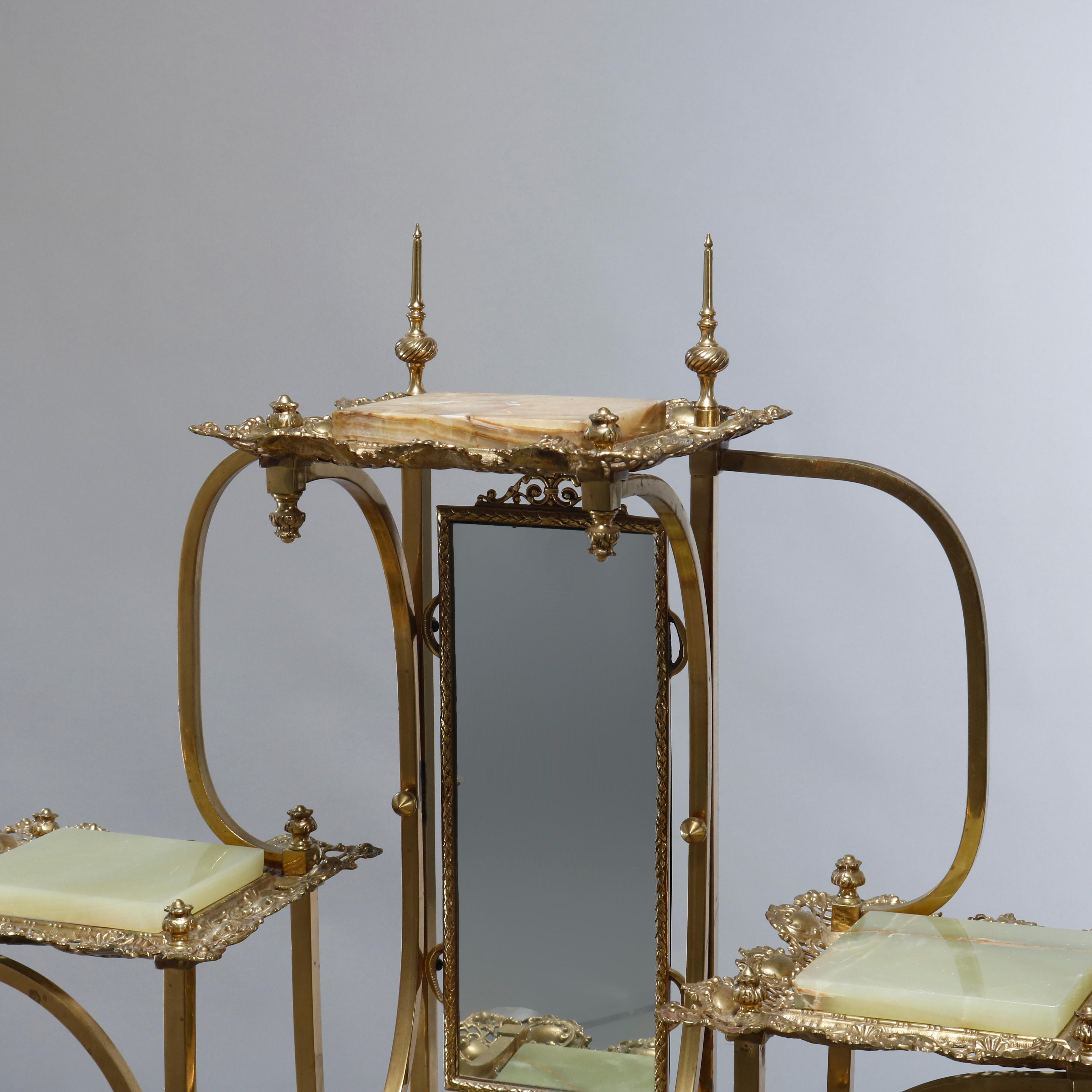 An antique French Victorian etagere offers cast bronze construction with curvilinear supports having finials and offset pierced foliate displays with onyx insets and central mirror, raised on foliate form cabriole legs, c1880.

Measures: 42