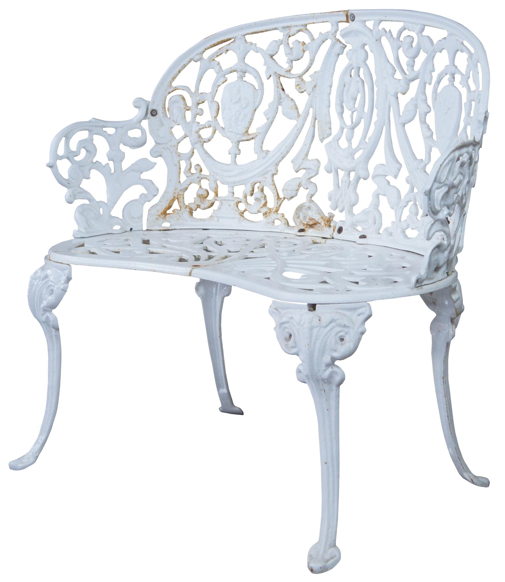 Antique French cast iron patio or garden bench. Made of cast iron featuring an ornate design with crest and scrolled seat.
 
