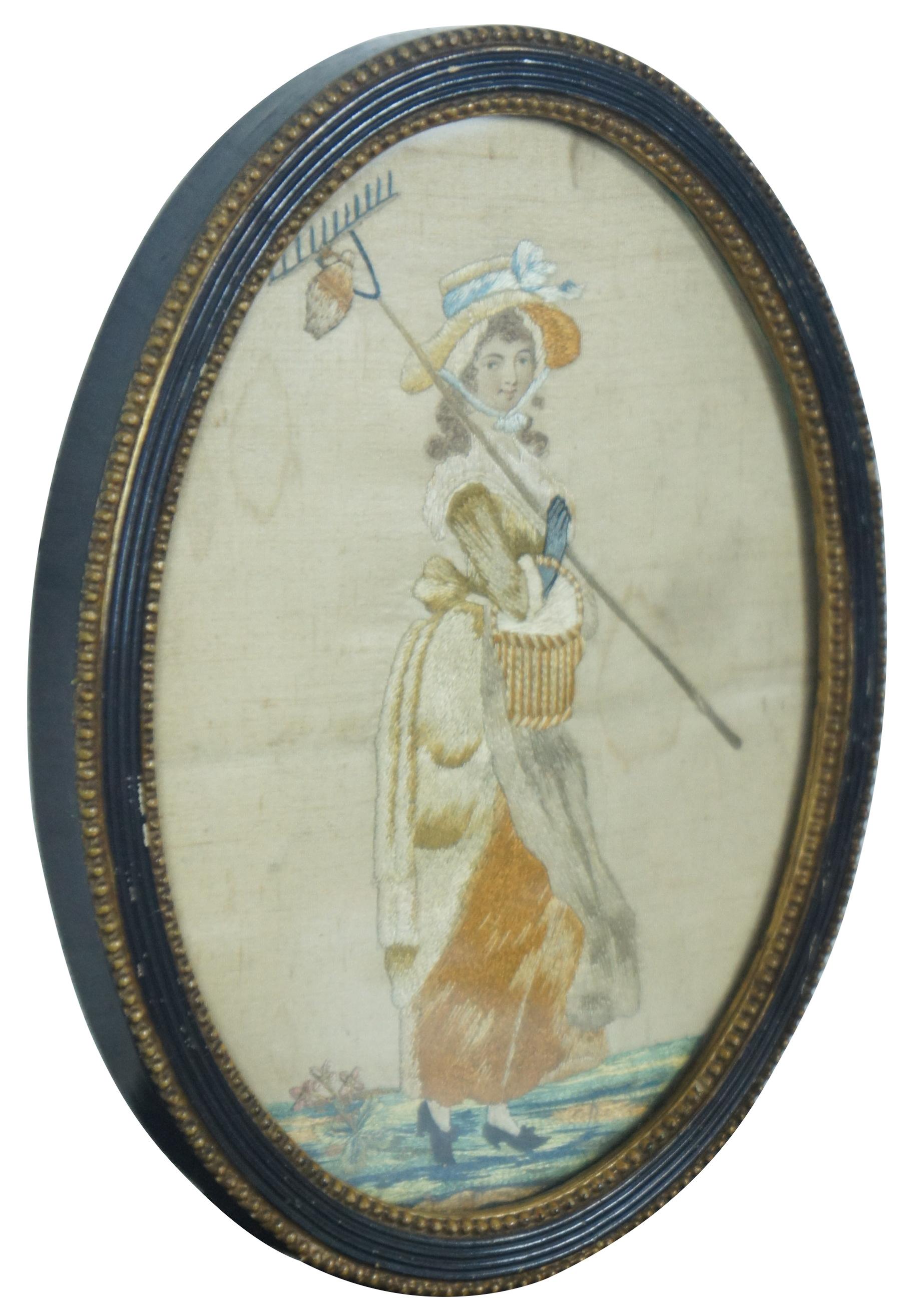 Antique French silk embroidered stumpwork picture of a pastoral woman in a seemingly fine dress and hat, carrying a basket and a rake.Size: 9