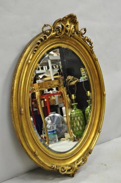Antique French Victorian Gold Scroll Espejo de pared ovalado de cristal biselado