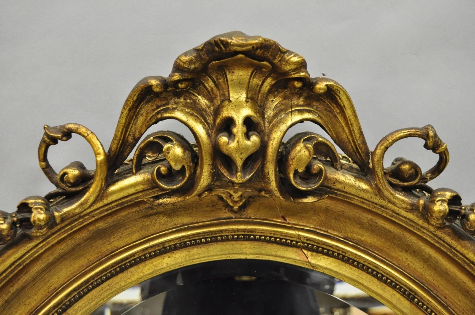 20th Century Antique French Victorian Gold Gilt Scroll Oval Beveled Glass Wall Mirror For Sale