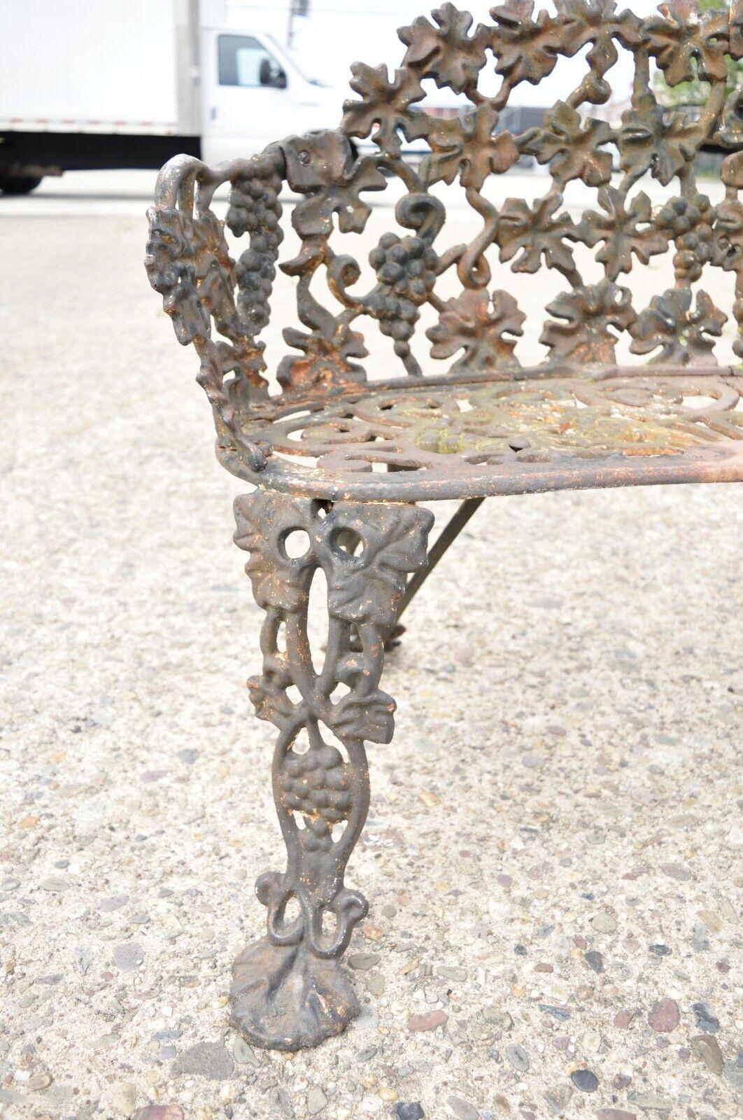 Antique French Victorian Grapevine Leaf Cast Iron Small Garden Bench Loveseat In Good Condition For Sale In Philadelphia, PA