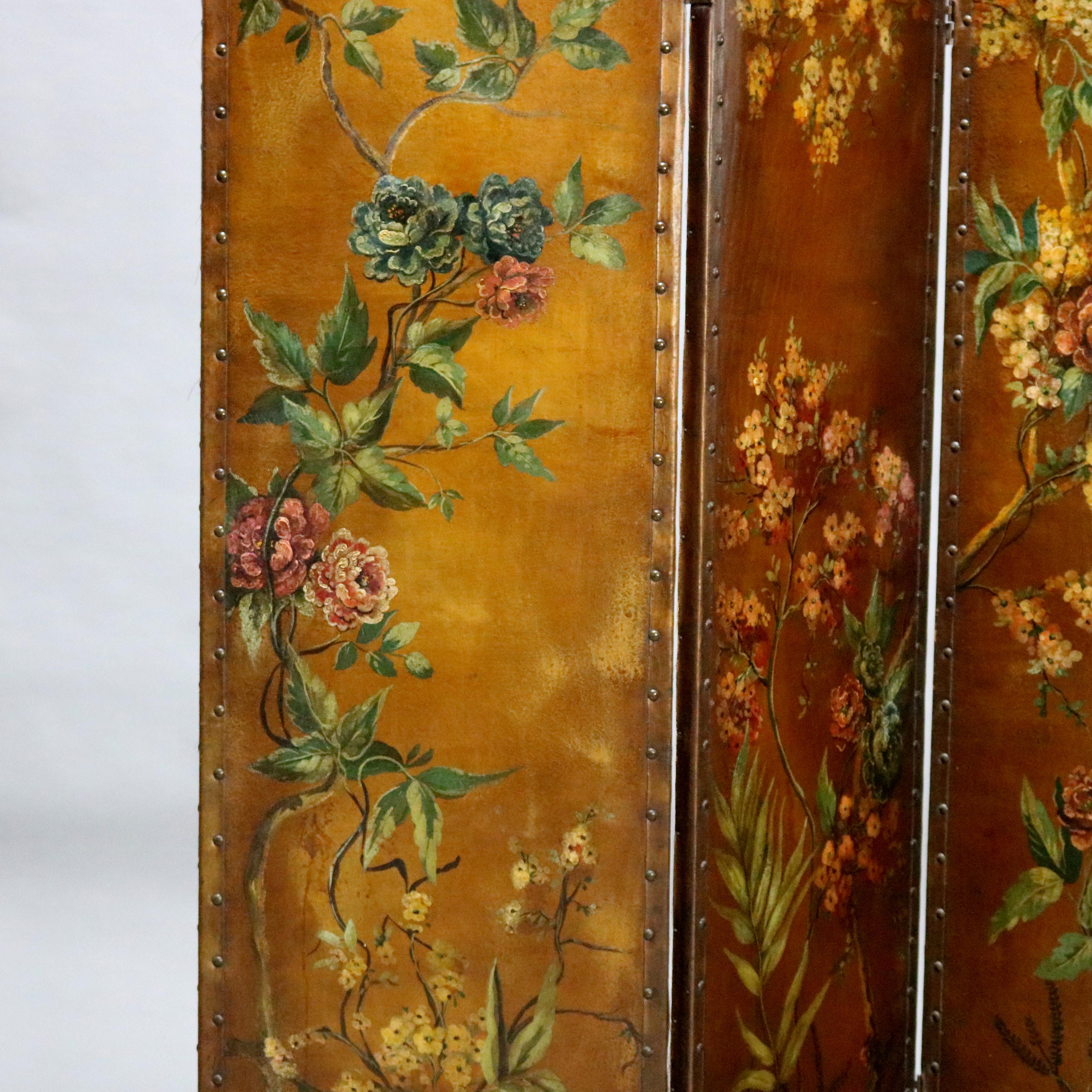 An antique French Victorian dressing screen offers three shaped and footed oil on canvas panels having hand painted floral garden scene, circa 1890.

Measures: 68.5