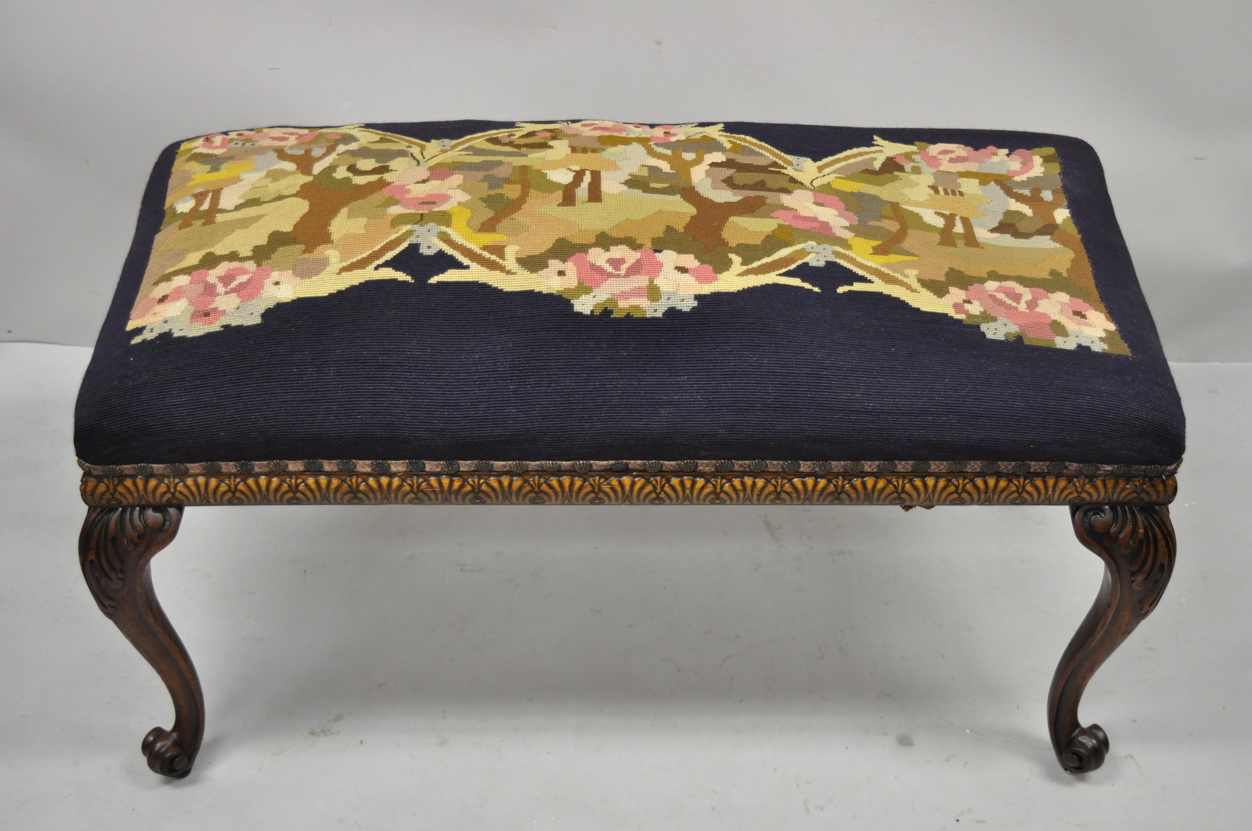 Antique French Victorian needlepoint carved cabriole leg mahogany bench. Item features a needlepoint seat, solid wood carved base, 