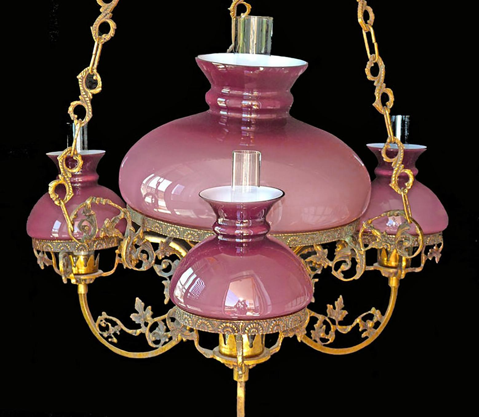Gorgeous antique circa 1940 French Victorian four-light bulbs chandelier with opaline pink cased glass and chiselled gilt bronze/ brass.
Measures:
Diameter 30 in / 76 cm
Height 37 in / 95 cm
Diameter glass shades: 14 in (36 cm)/ 9 in (23 cm)/