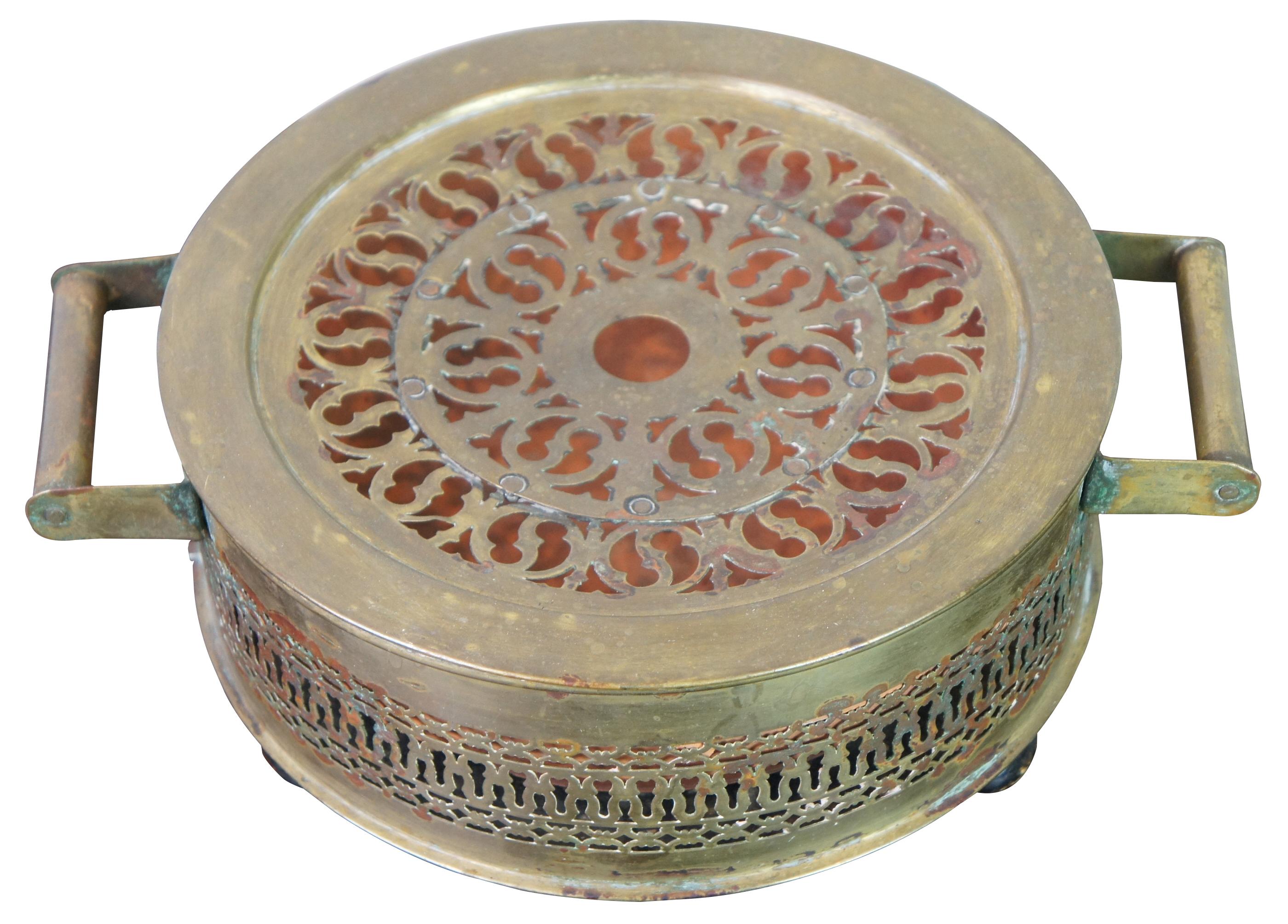 Antique French Victorian reticulated brass foot warmer featuring turned feet, handles and terracota insert. Measure: 11