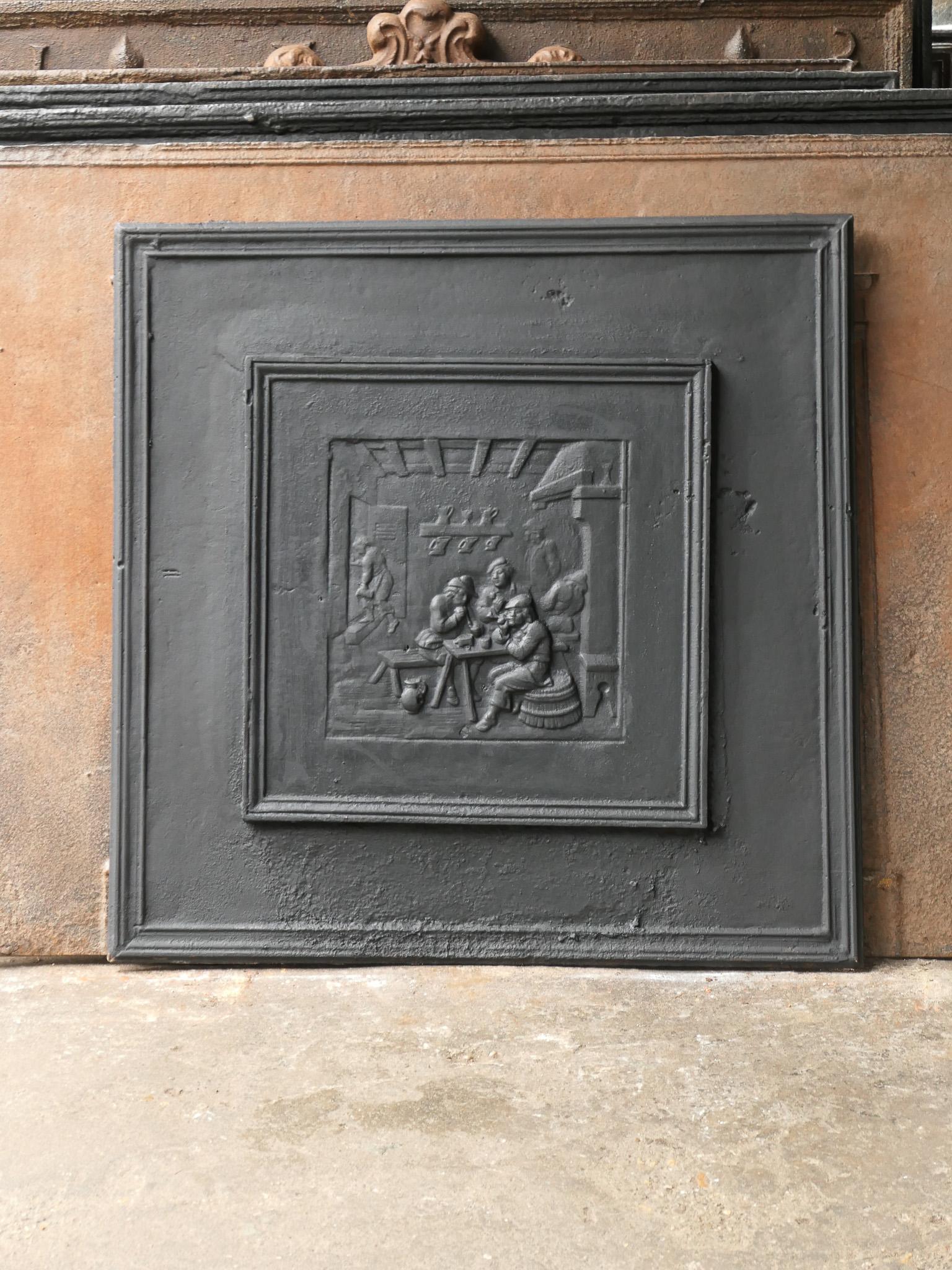 Early 20th century French Napoleon III fireback with a pub scene. The fireback is made of cast iron and the patina is black / pewter. 

This product weighs more than 65 kg / 143 lbs. All our products that weigh 66 kg / 146 lbs or more are shipped as