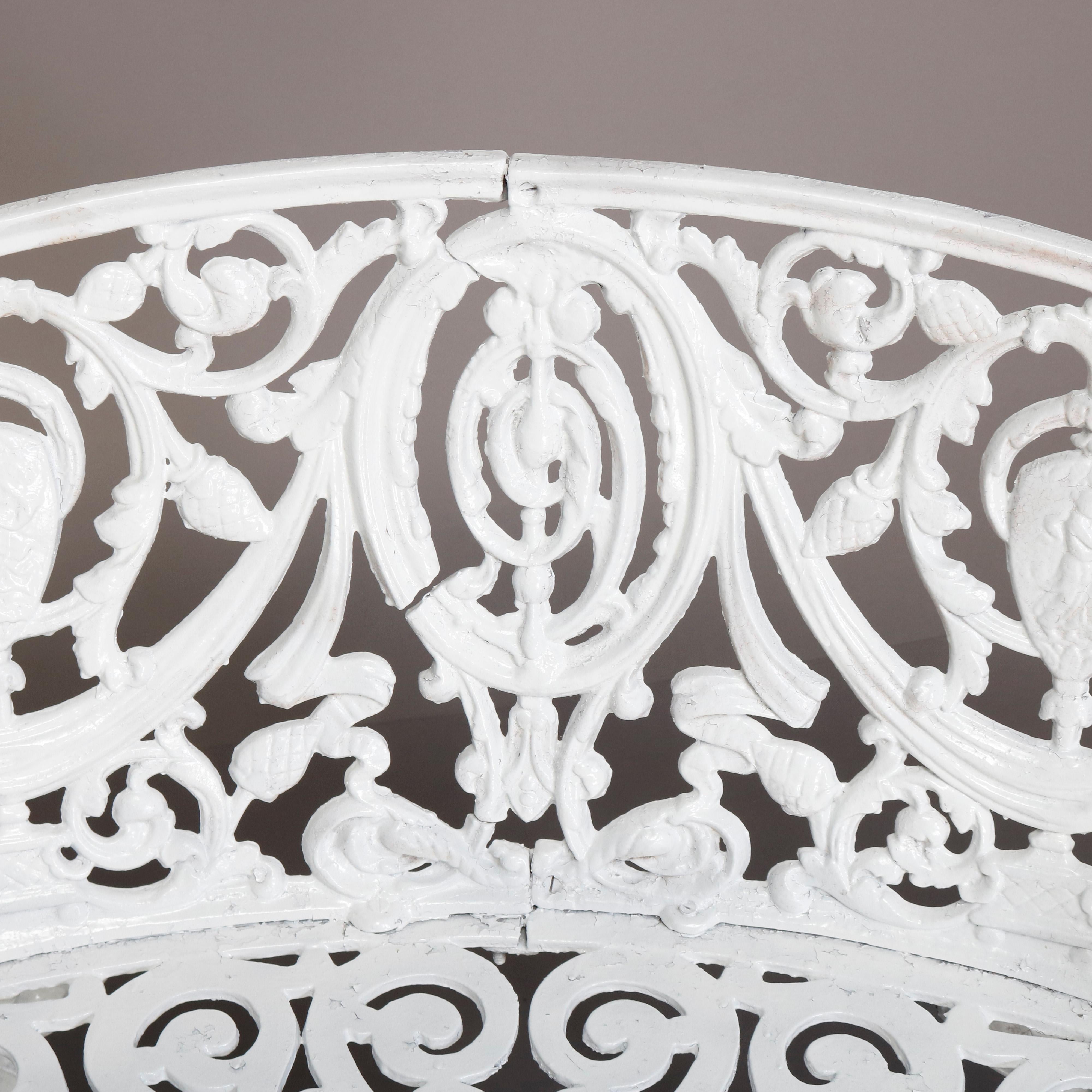 An antique French Victorian white painted cast iron garden bench offers central foliate medallion flanked by urns, drape, scroll and foliate elements, circa 1890

***DELIVERY NOTICE – Due to COVID-19 we are employing NO-CONTACT PRACTICES in the