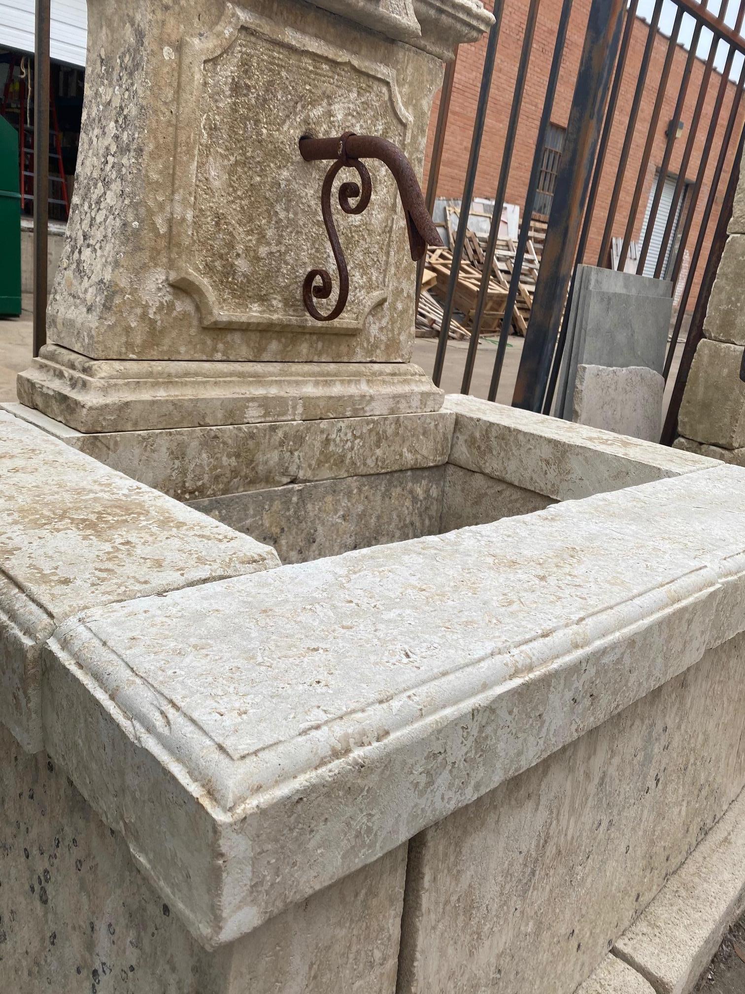 This wall fountain dates back to the 1890s, France, and is made of limestone. Features nice natural patina.

Measurements: 32'' D x 51'' H x 46'' W.