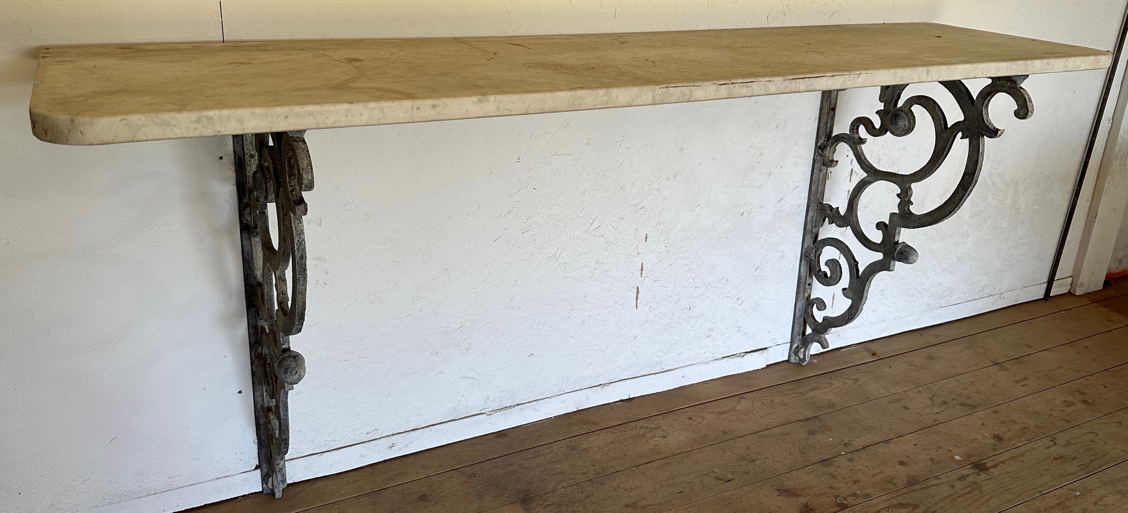 The Rococo Baroque style wall hung brackets are topped with an antique marble top making them a beautiful addition to any home, garden or patio.
These shelving brackets will make a wonderful console table in an entry foyer, a dining room, or in a