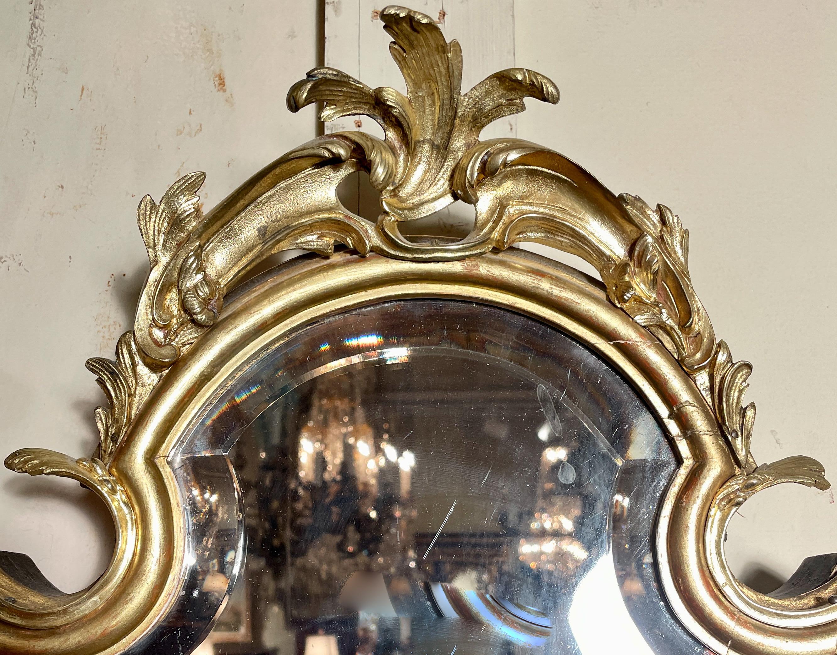 Rare antique French carved wall mirror and jewel box with beveling and gold-leaf, circa 1890.
