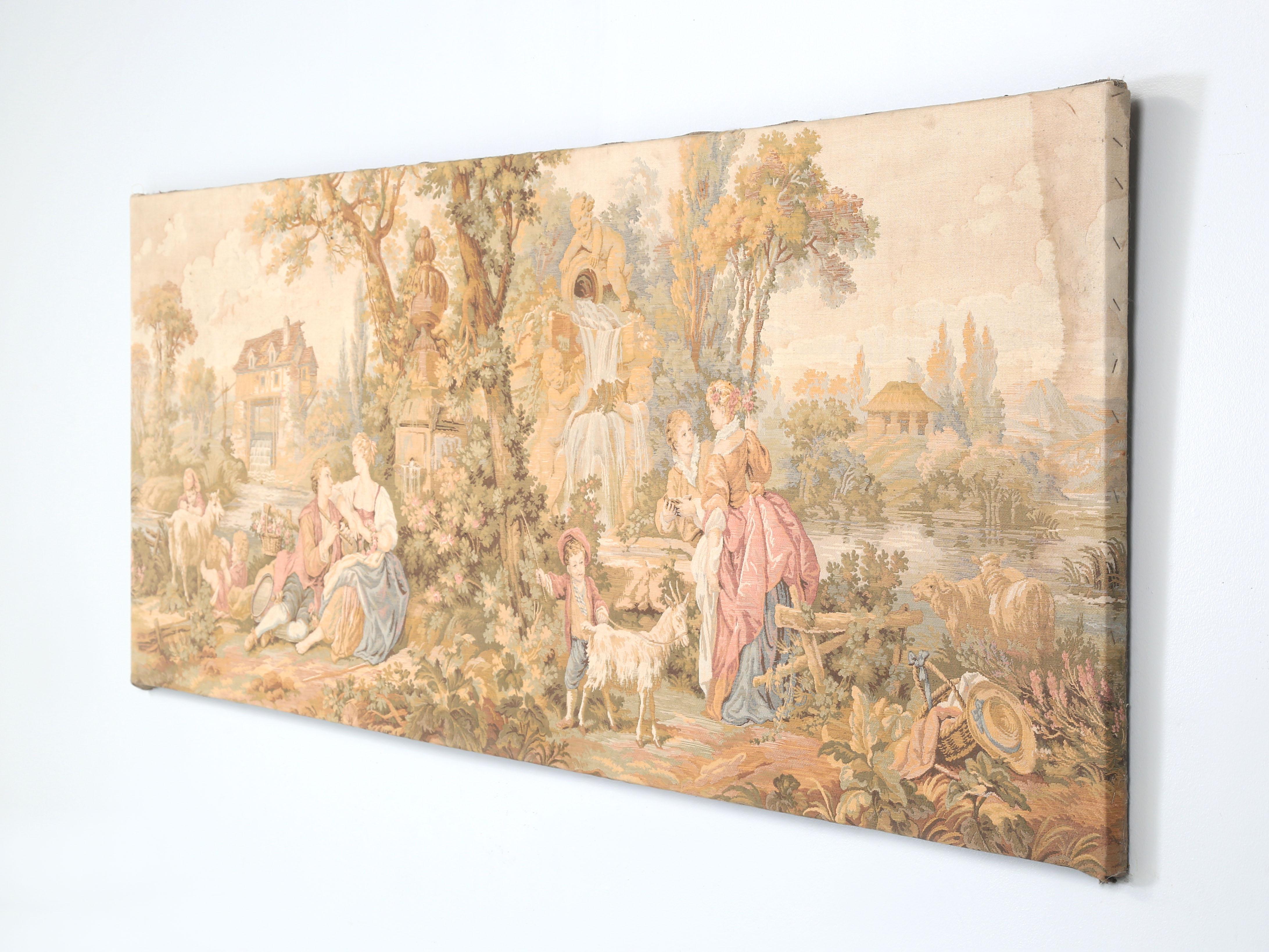 Antique French Scenic and Tranquil Wall Tapestry probably made in the early 1900's. There are no signs of prior repairs, although there is the normal sun-fade one typically sees in older French wall tapestry's. There is a minor stain along the right