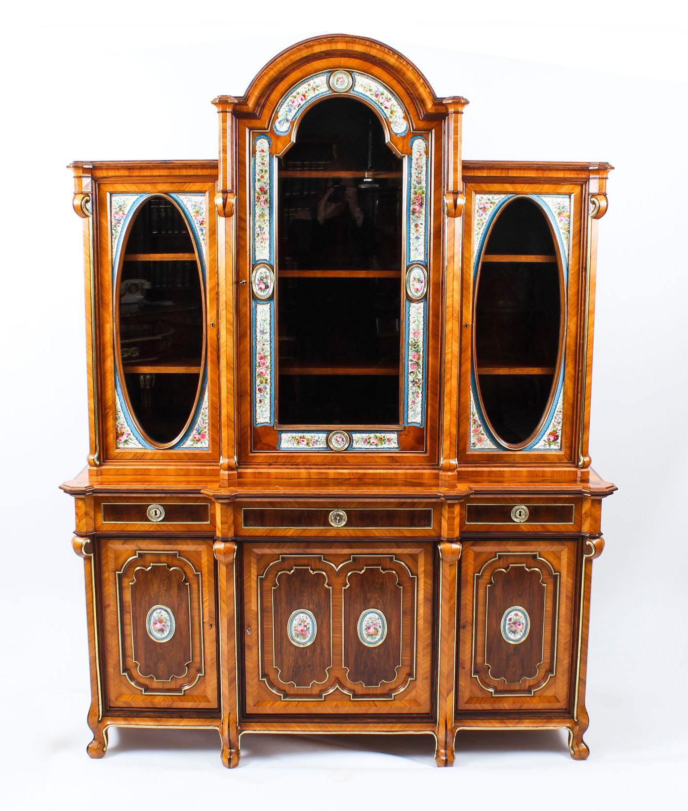 A stunning 19th century French kingwood and walnut, ormolu and Sevres porcelain mounted breakfront display cabinet. cabinet C1880 in date.

This stunning antique French side cabinet is a true rarity and has been accomplished in exotic Kingwood,