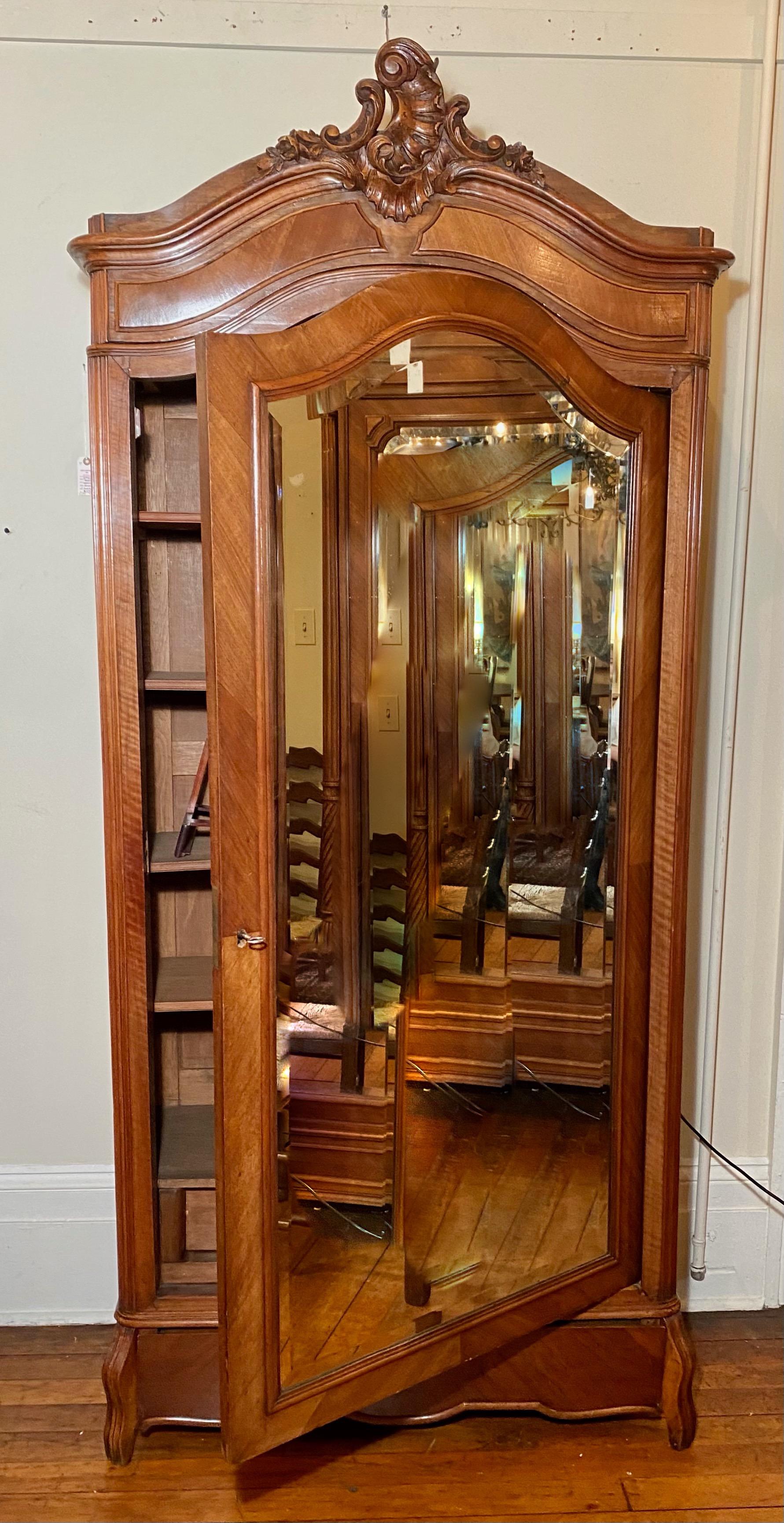 Antique French walnut beveled mirror armoire, circa 1900.

       