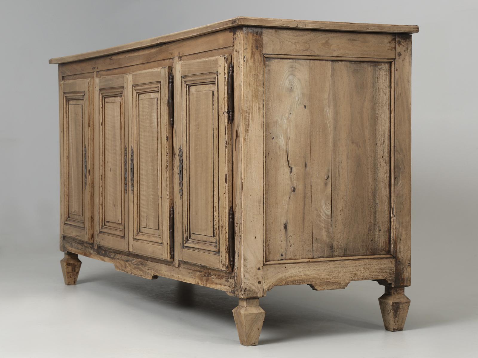 Antique French Country Style walnut buffet, that has successfully managed to escape the ravage hands of amateur restorers for more than 200-years. Other than several very old repairs at the base, which are quite typical for genuine antique French