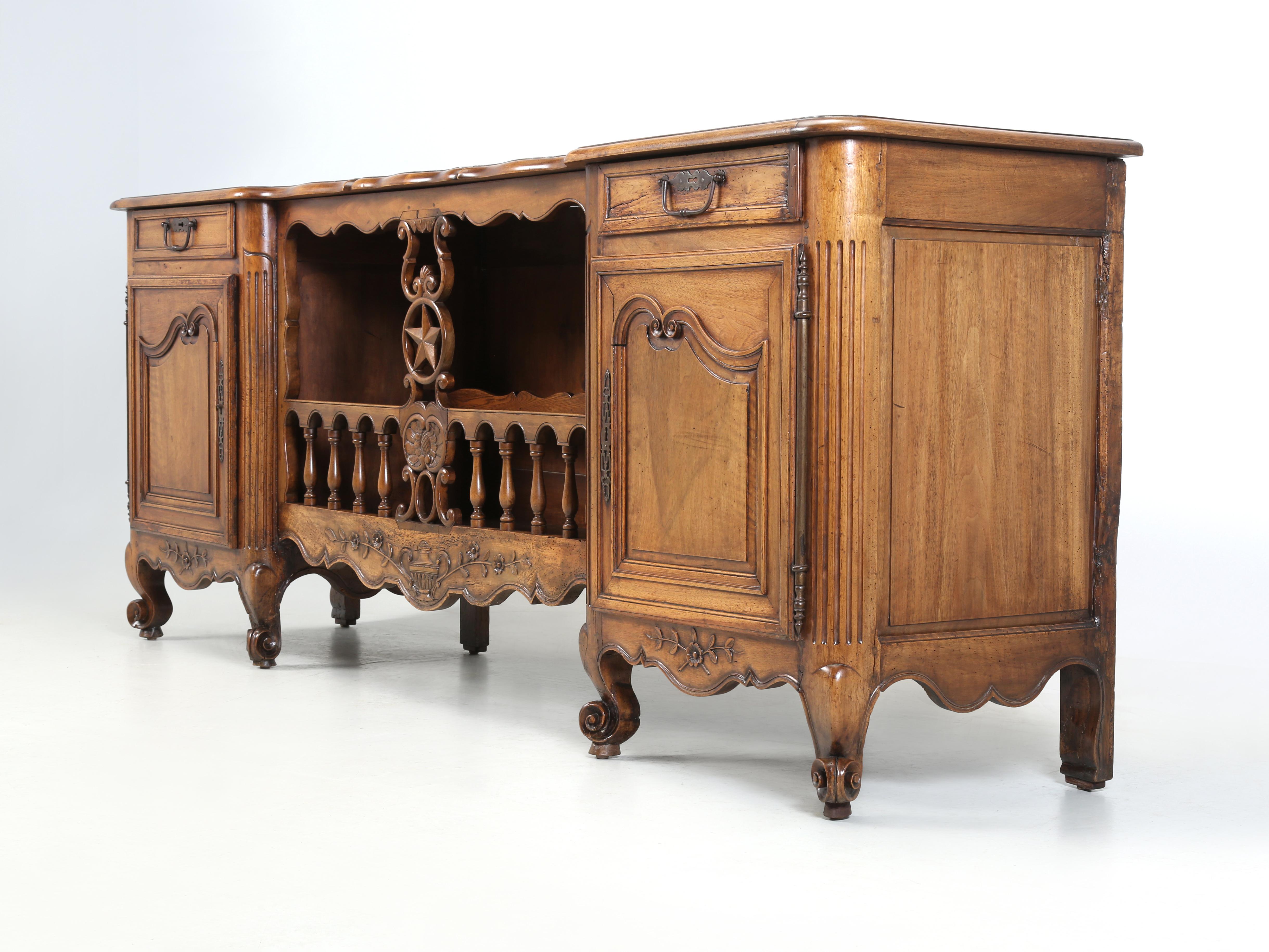 Antique French Walnut Buffet with an unusual open center section to display your favorite items. In our 30-plus years of importing French Antiques, we have only seen a handful of this particular style French Buffet and this is probably the nicest