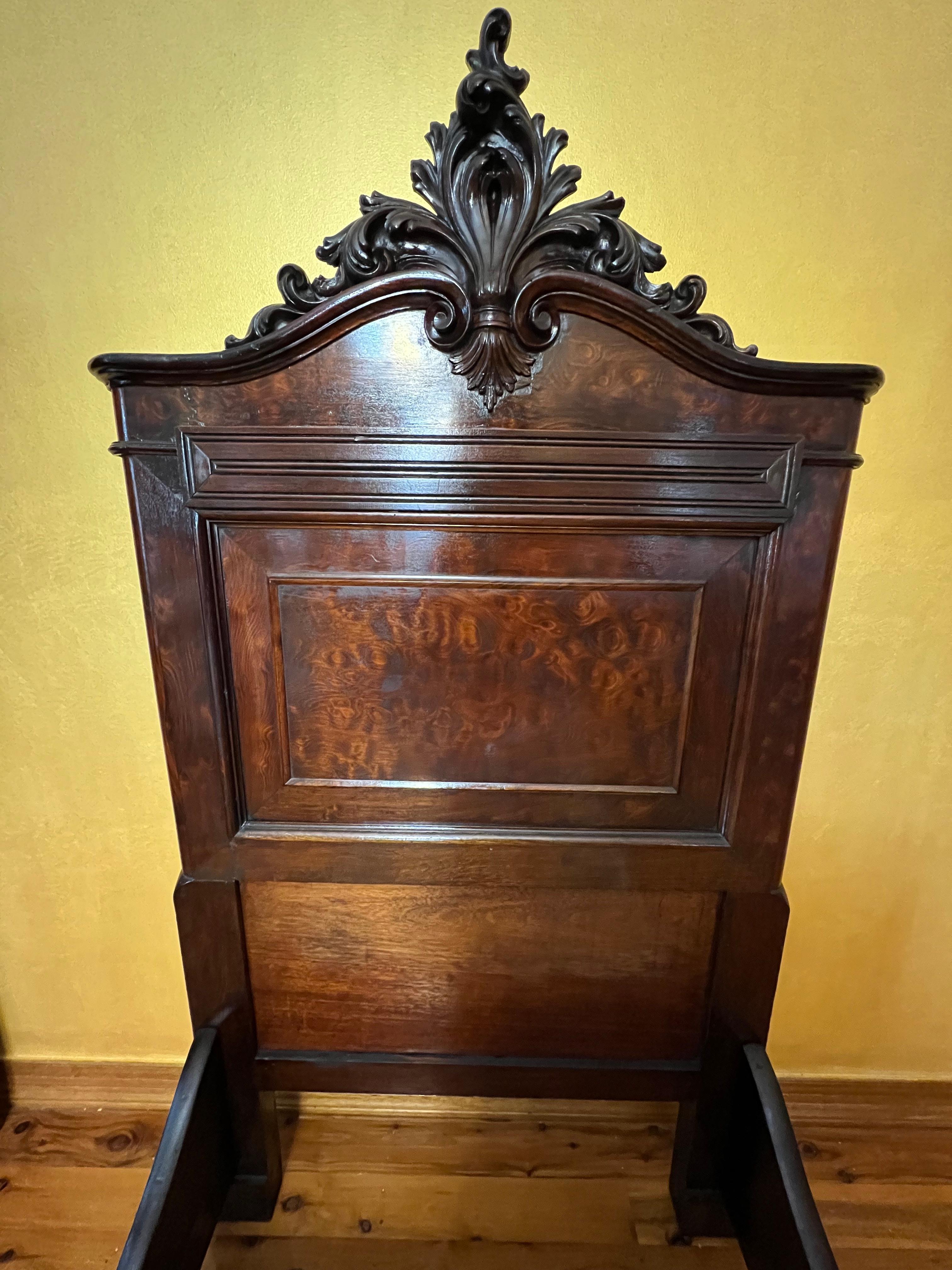 Centre detail carving detail, burl walnut detail throughout, comes with slats, some wear too frame due to age and use.

Size: Single Bed

Circa: 19th century

Material: Walnut

Country of Origin: France

Measurements

Headboard: 169cm