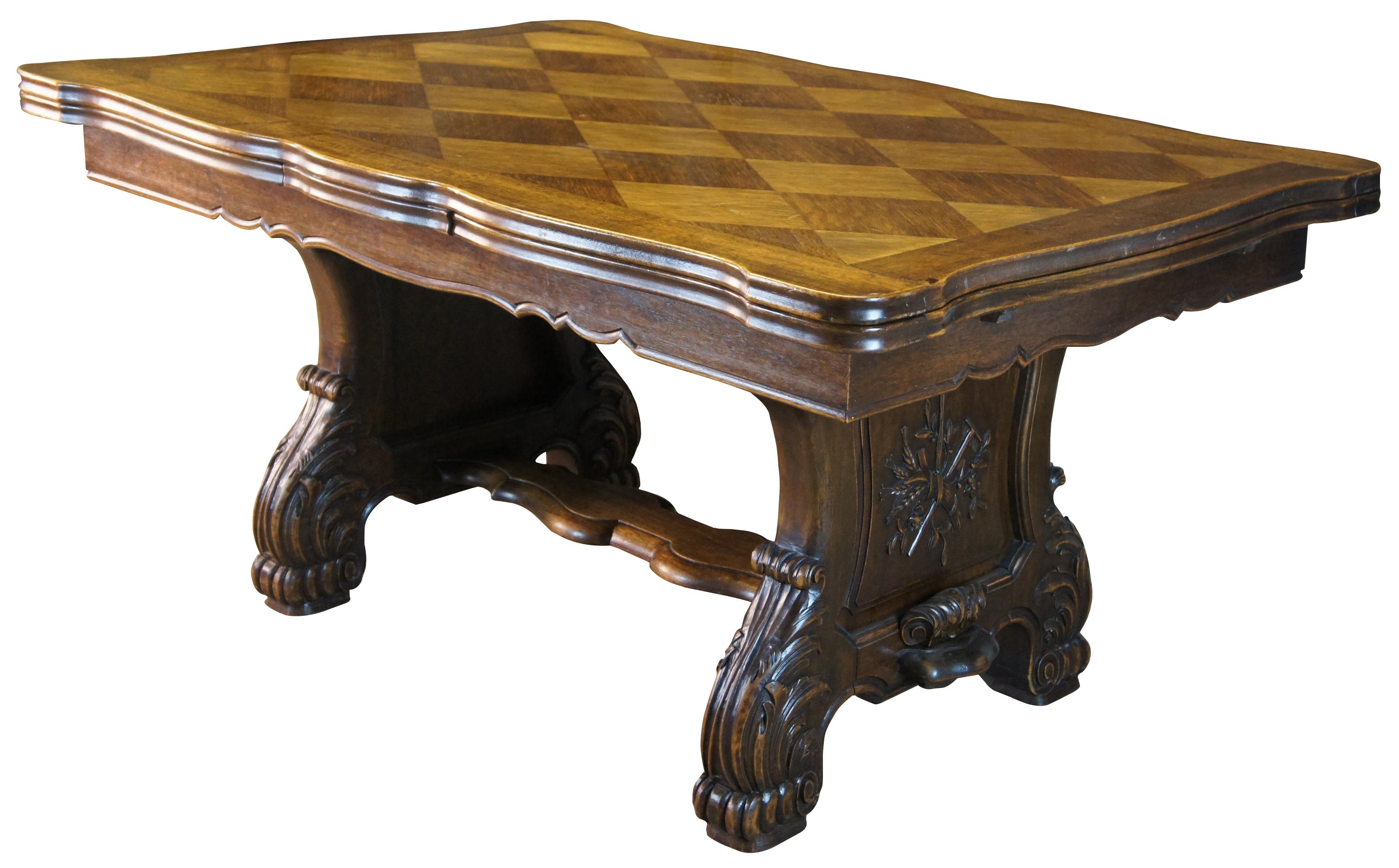 Antique French walnut Draw Leaf extension dining table. Features a stunning diamond inlay parquetry top with serpentine shape. The table is supported by a rectangular apron with matching cut to top and trestle base. The table base includes paneled