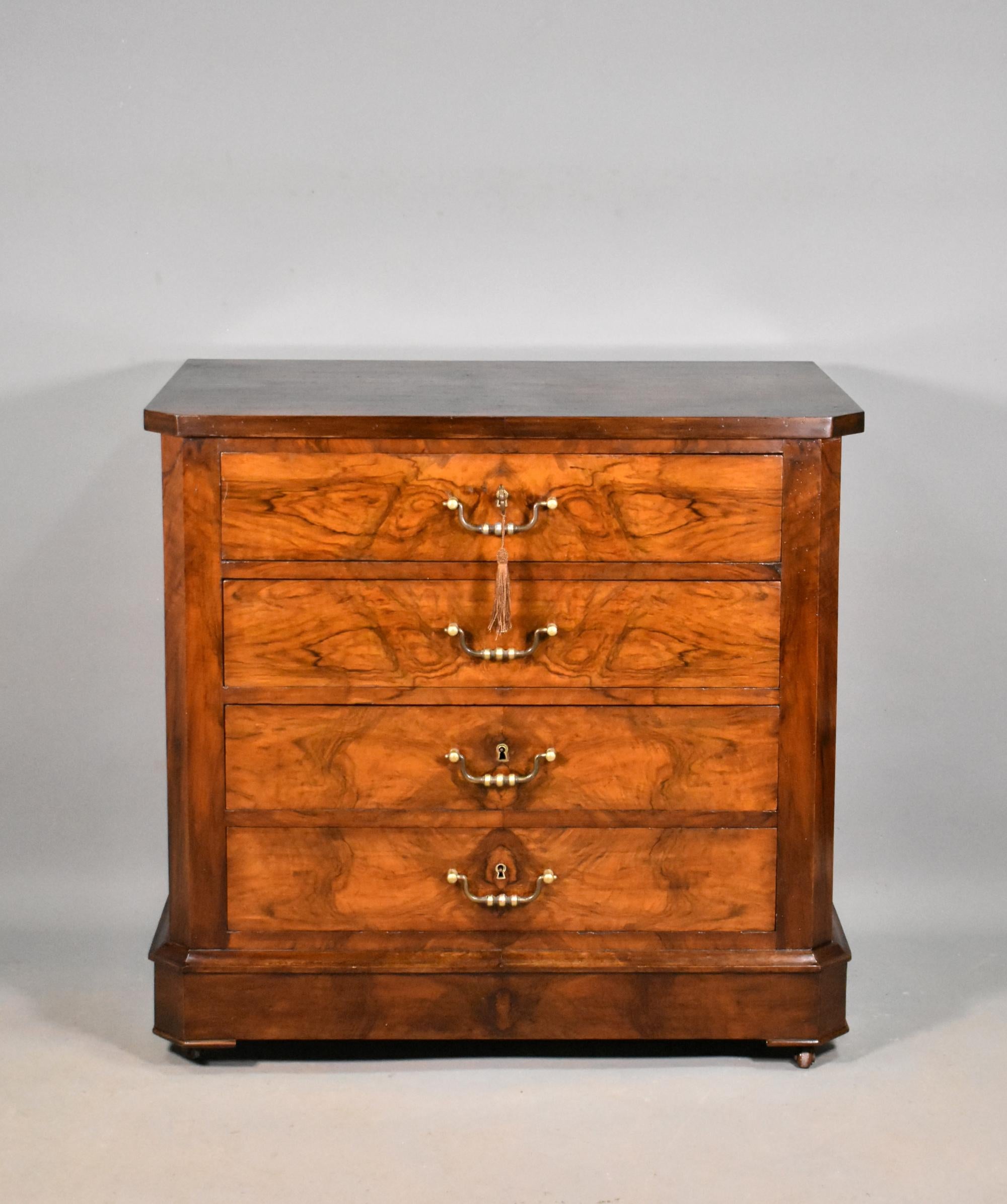 Antique French four drawer walnut commode Louis Philippe Style 

A well-proportioned antique commode featuring four equal-sized drawers of full width. 

The drawers are constructed in oak and have dovetail joints with a wild book-matched walnut