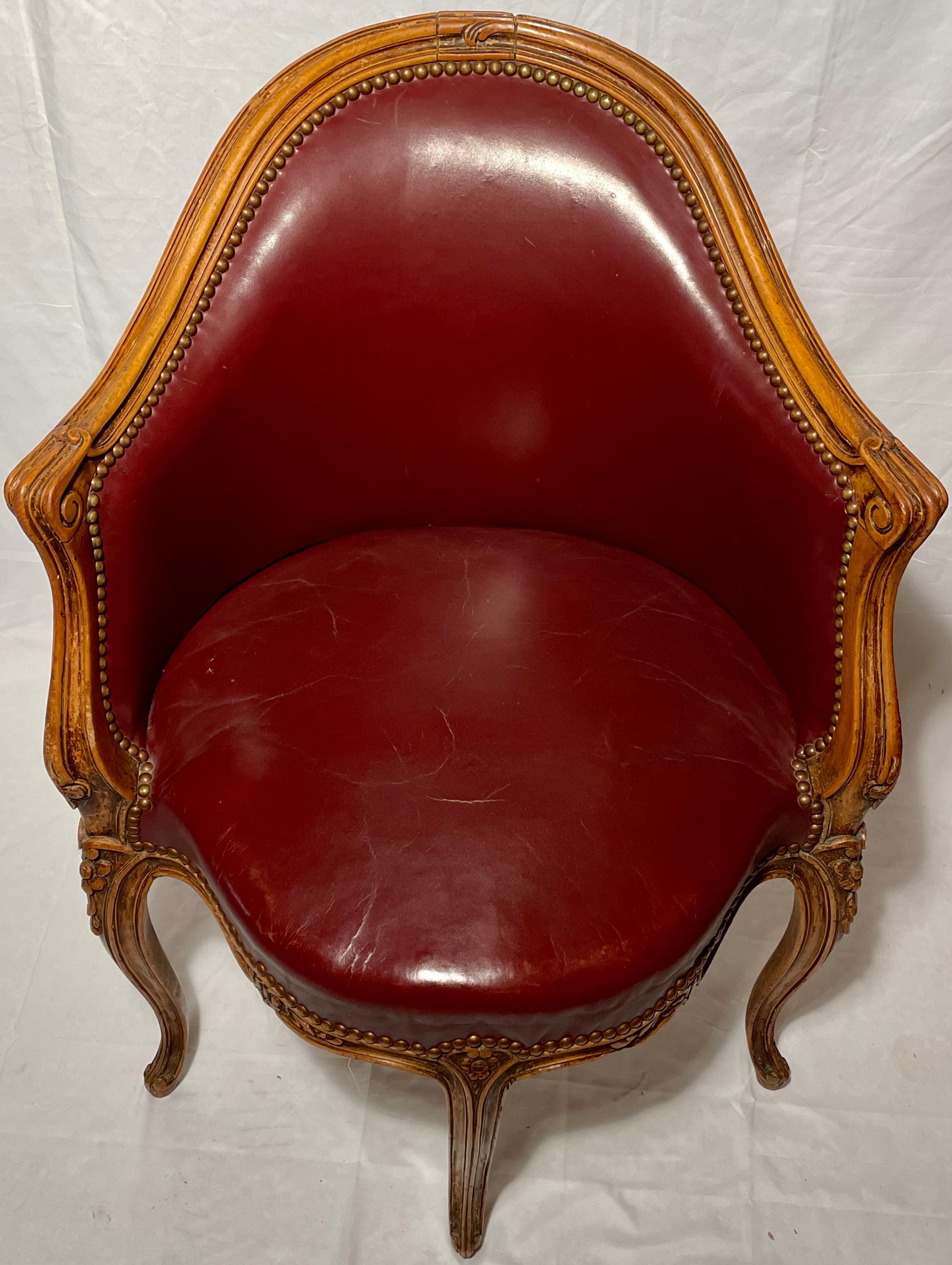 Antique French carved walnut desk chair, circa 1880.
With Burgundy Leather Upholstery. 